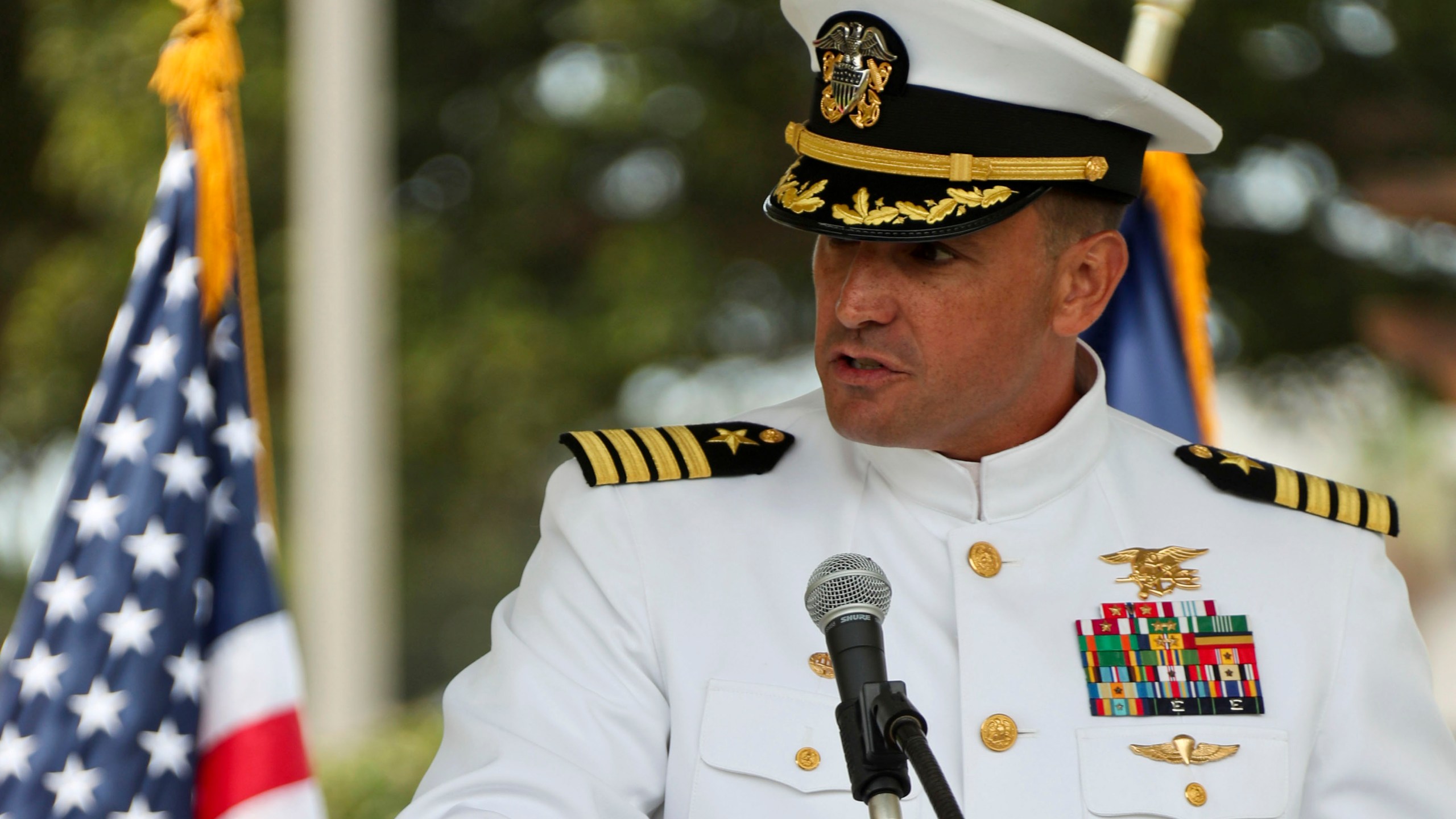 In this image provided by the U.S. Navy, Capt. Brian Drechsler, commanding officer, Naval Special Warfare Center (NSWCEN), speaks during a change of command ceremony at Naval Amphibious Base Coronado, on July 23, 2021. U.S. officials say Dreschler, who was reprimanded in connection with the death in 2022 of a Navy SEAL candidate, has been pulled out of his job about two months early.(Mass Communication Spc. 1st Class Anthony W. Walker/U.S. Navy via AP)