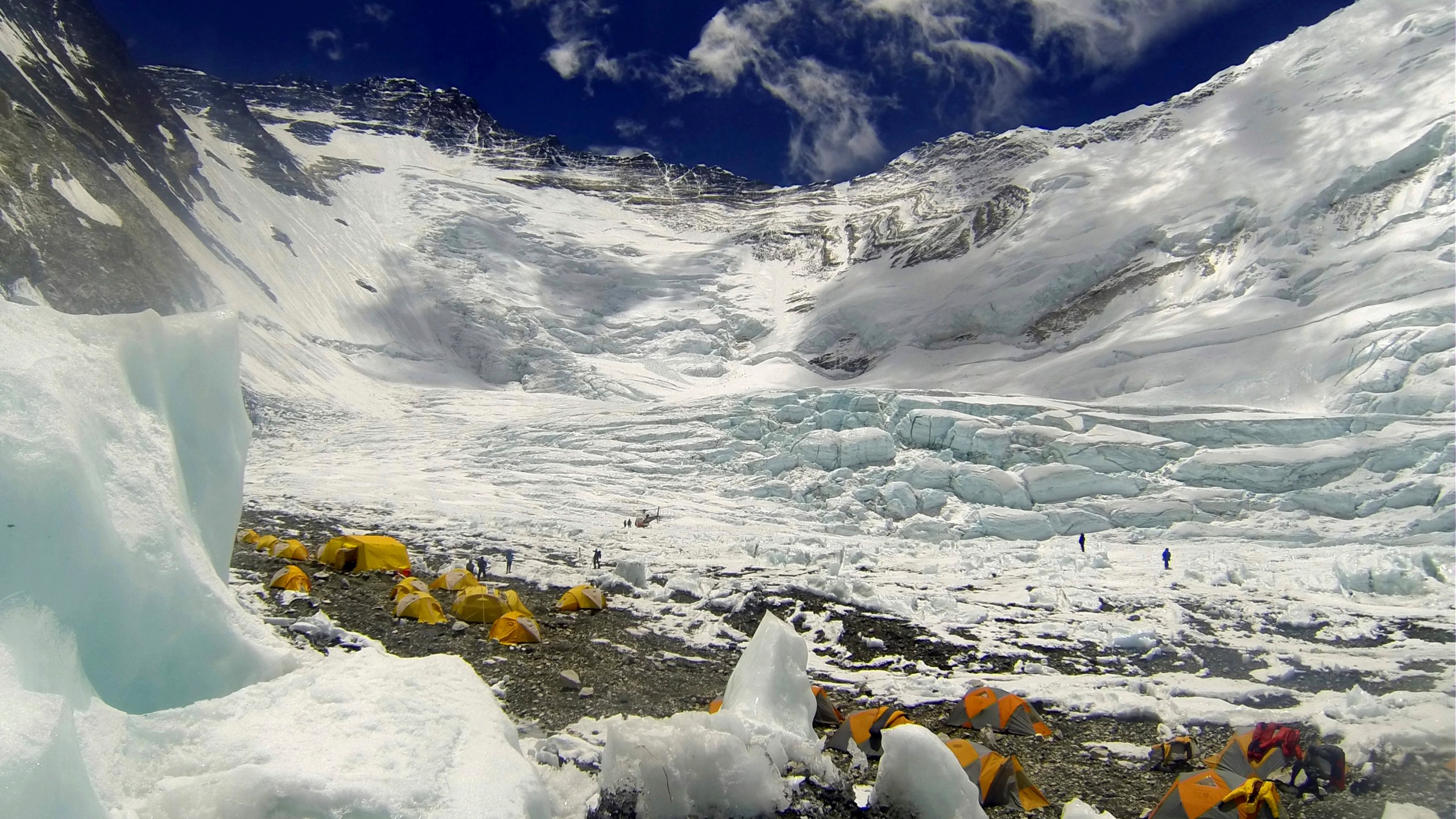 FILE - Tents are pitched on Camp 2, as climbers rest on their way to summit the 8,850-meter (29,035-foot) Mount Everest on May 16, 2013. University of Washington officials say a retired Seattle doctor died on Monday, May 1, 2023, while climbing Mount Everest. Dr. Jonathan Sugarman was climbing the mountain as part of an expedition arranged by Washington state-based International Mountain Guides. The company said on their website that one of their team members died on the mountain but that the death wasn't an accident. (AP Photo/ Pasang Geljen Sherpa,File)