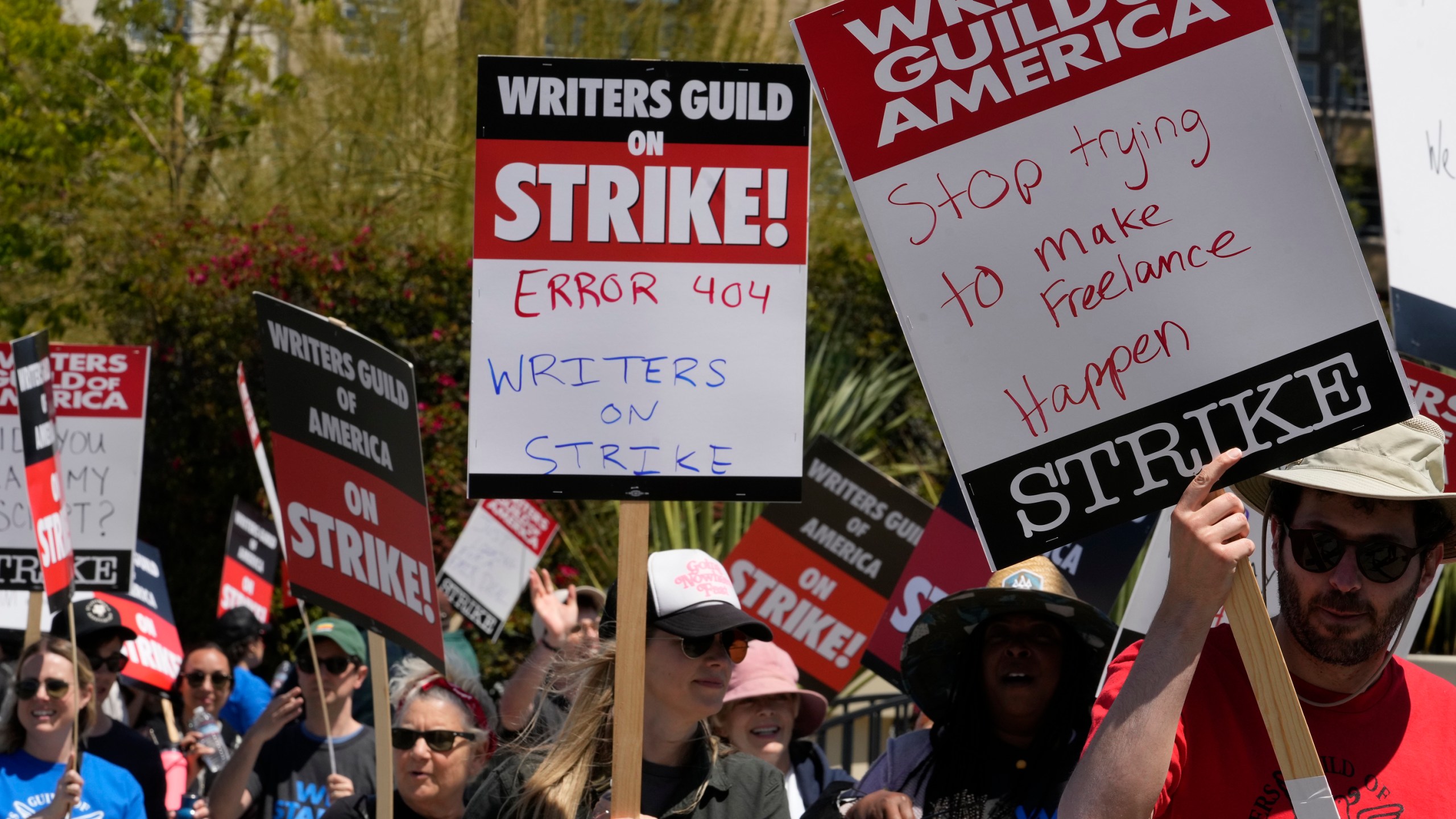 Members of the Writers Guild of America, WGA picket outside CBS Television City in the Fairfax District of Los Angeles Tuesday, May 2, 2023. The first Hollywood strike in 15 years began Tuesday as the economic pressures of the streaming era prompted unionized TV and film writers to picket for better pay outside major studios, a work stoppage that already is leading most late-night shows to air reruns. (AP Photo/Damian Dovarganes)