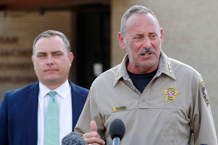 San Jacinto County Sheriff's Office chief deputy Tim Kean, right, introduces county district attorney Todd Dillon, left, during a news conference regarding suspect Francisco Oropeza at the San Jacinto County Public Safety Building Wednesday, May 3, 2023, in Coldspring, Texas. Oropeza, suspected of killing five of his neighbors Friday night, is in custody. (AP Photo/Michael Wyke)