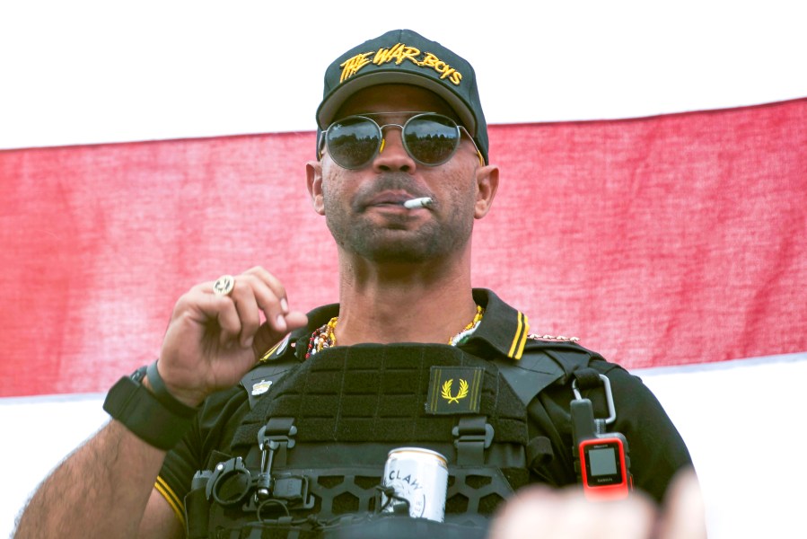 FILE - Proud Boys leader Henry "Enrique" Tarrio wears a hat that says The War Boys during a rally in Portland, Ore., Sept. 26, 2020. Tarrio and three other members of the far-right extremist group have been convicted of a plot to attack the U.S. Capitol in a desperate bid to keep Donald Trump in power after Trump lost the 2020 presidential election. (AP Photo/Allison Dinner, File)