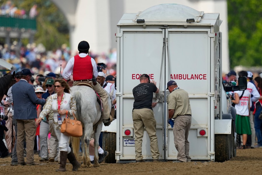 Here Mi Song is taken to the equine ambulance after the10th horse race at Churchill Downs Saturday, May 6, 2023, in Louisville, Ky. (AP Photo/Julio Cortez)