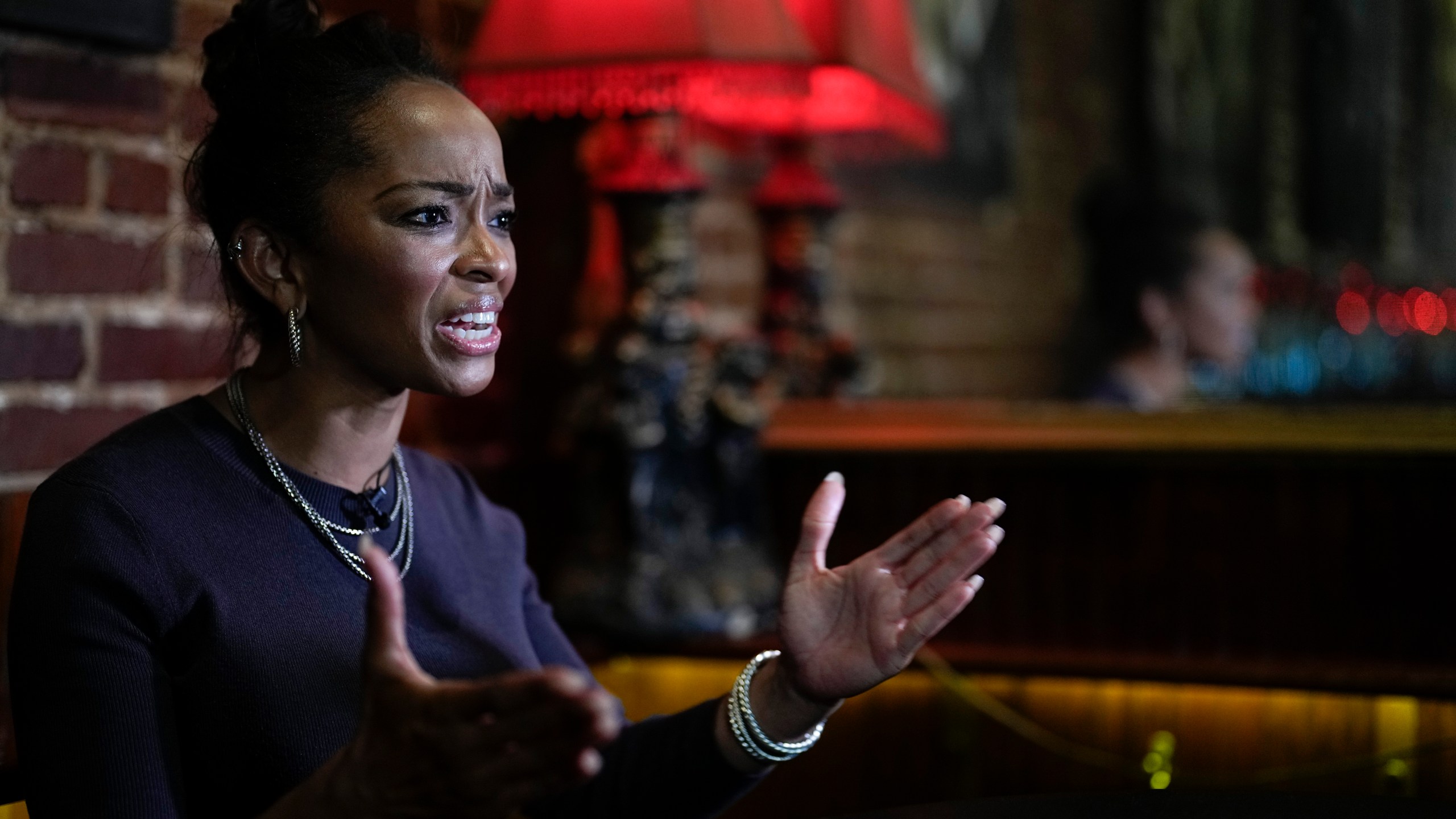 LaJoia Broughton, a 41-year-old small business owner, speaks during an interview at Goat's restaurant and Tavern on Tuesday, May 2, 2023, in Columbia, S.C. Black voters in South Carolina rescued Joe Biden’s bid for the presidency during the 2020 Democratic primary, and he rewarded them by moving the state to the head of the party’s nominating schedule. But two years into his presidency, interviews with more than a dozen Black voters representing a variety of ages and backgrounds reveal mixed views, especially between generations. (AP Photo/Chris Carlson)