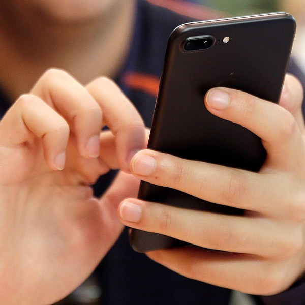 FILE - A person uses a smartphone in Chicago, Sept. 16, 2017. Most Democrats and Republicans agree that the federal government should better regulate the biggest technology companies, particularly social media platforms. But there is very little consensus on how it should be done. (AP Photo, File)