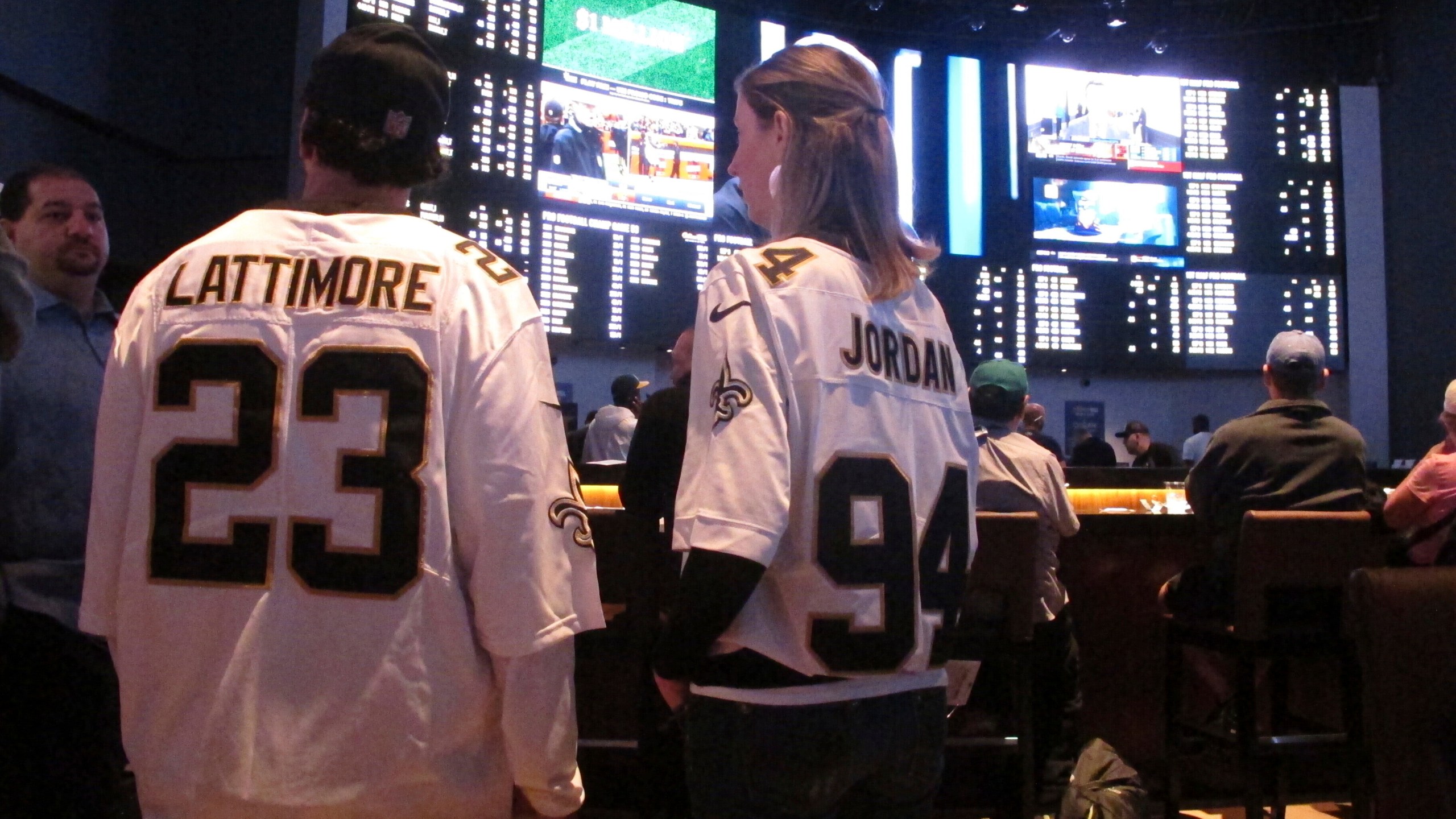 FILE - Customers at the Ocean Casino Resort in Atlantic City N.J. on Sept. 9, 2018, await the kickoff of the first NFL season after a US Supreme Court ruling clearing the way for legal sports betting. Americans have bet over $220 billion on sports with legal gambling outlets in the five years since that ruling. (AP Photo/Wayne Parry, File)