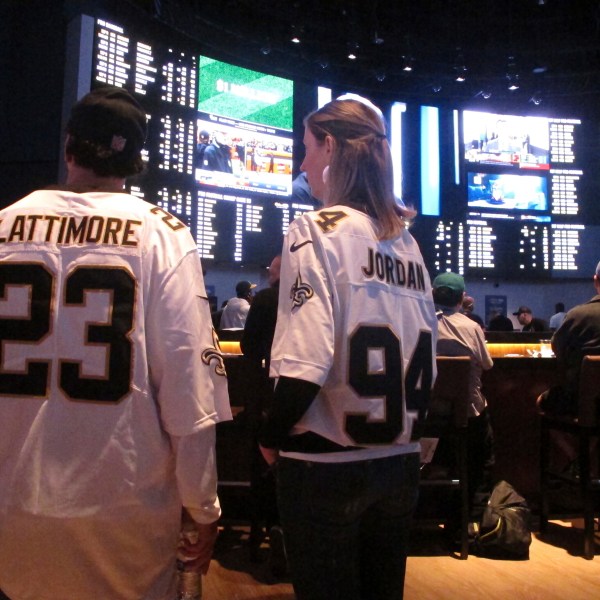 FILE - Customers at the Ocean Casino Resort in Atlantic City N.J. on Sept. 9, 2018, await the kickoff of the first NFL season after a US Supreme Court ruling clearing the way for legal sports betting. Americans have bet over $220 billion on sports with legal gambling outlets in the five years since that ruling. (AP Photo/Wayne Parry, File)