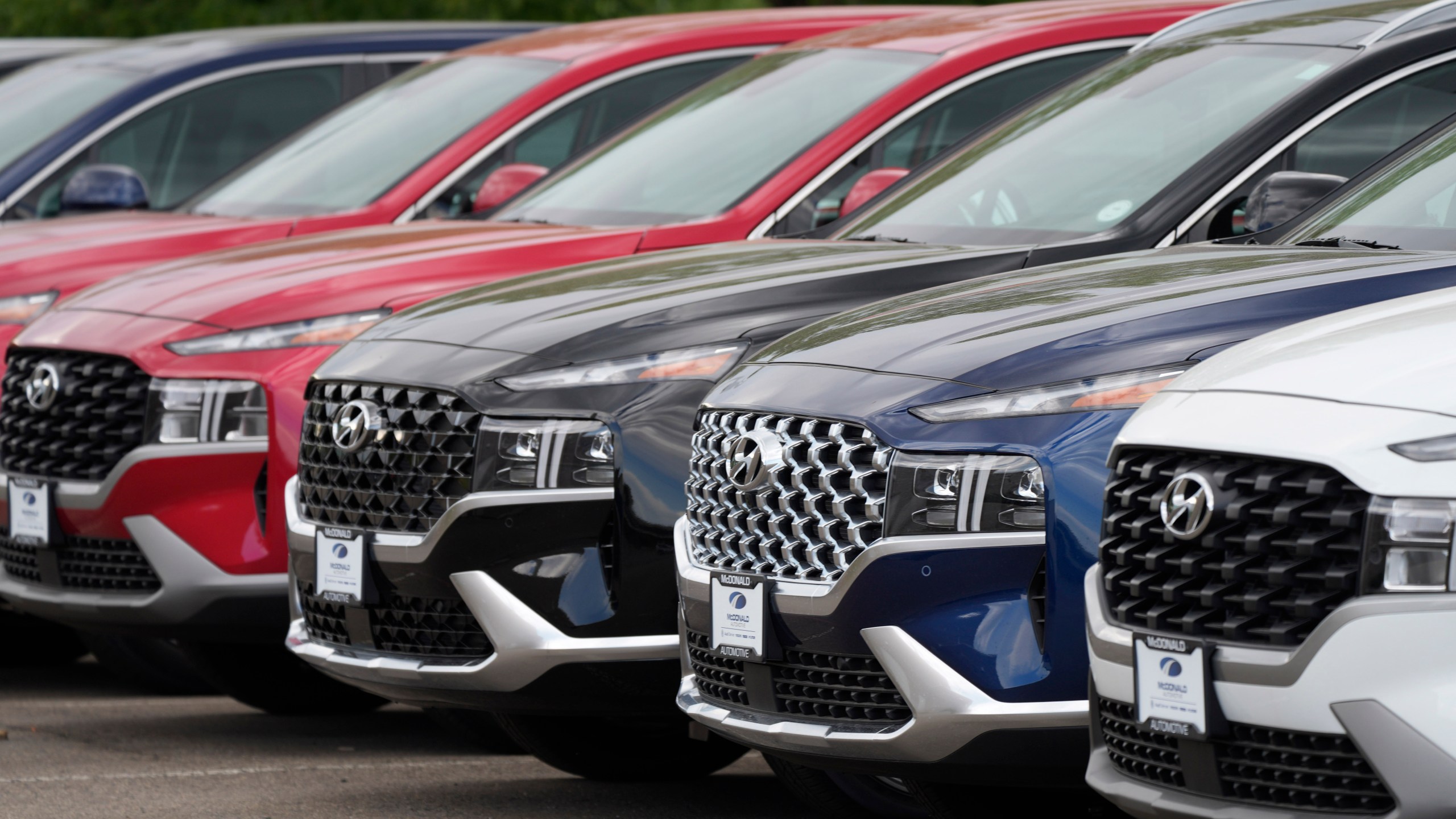 A line of 2022 Santa Fe SUV's sit outside a Hyundai dealership Sunday, Sept. 12, 2021, in Littleton, Colo. Nearly three months after Hyundai and Kia rolled out new software designed to thwart rampant auto thefts, crooks are still driving off with the vehicles at an alarming rate. (AP Photo/David Zalubowski)