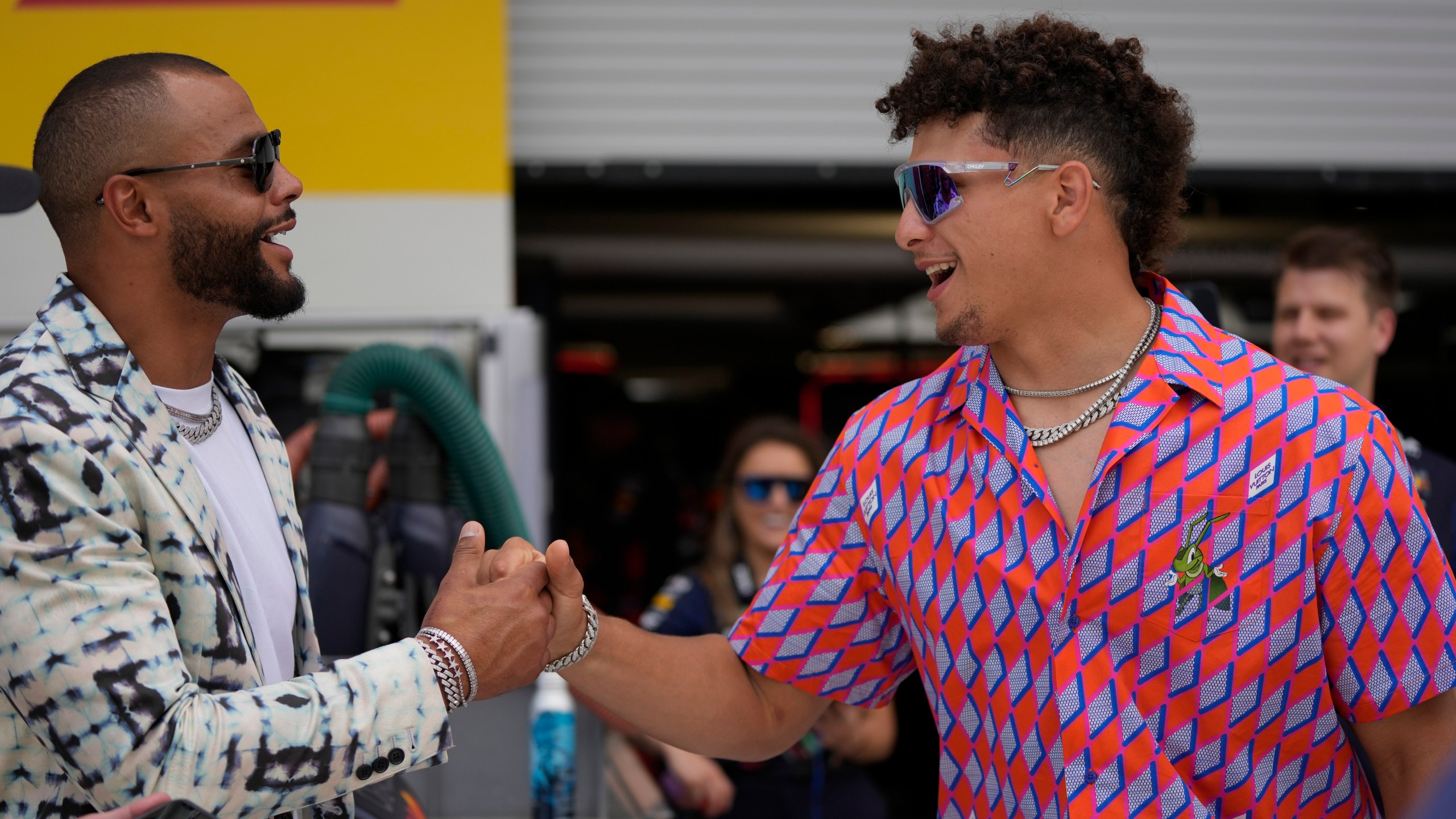 Dallas Cowboys quarterback Dak Prescott , left, and Kansas City Chiefs quarterback Patrick Mahomes greet each other in the Red Bull garage before the Formula One Miami Grand Prix auto race at the Miami International Autodrome, Sunday, May 7, 2023, in Miami Gardens, Fla. (AP Photo/{sum}) (AP Photo/Rebecca Blackwell)