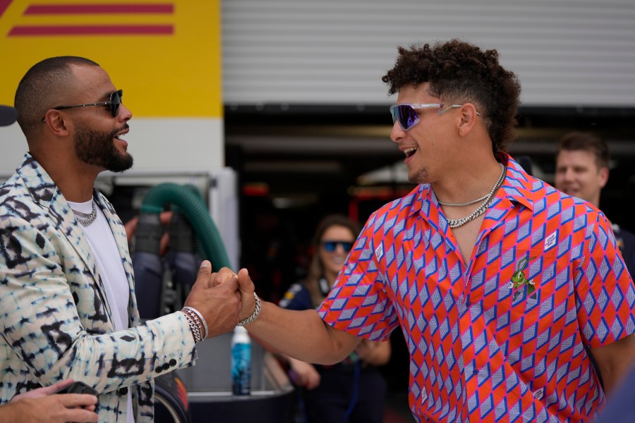 Dallas Cowboys quarterback Dak Prescott , left, and Kansas City Chiefs quarterback Patrick Mahomes greet each other in the Red Bull garage before the Formula One Miami Grand Prix auto race at the Miami International Autodrome, Sunday, May 7, 2023, in Miami Gardens, Fla. (AP Photo/{sum}) (AP Photo/Rebecca Blackwell)