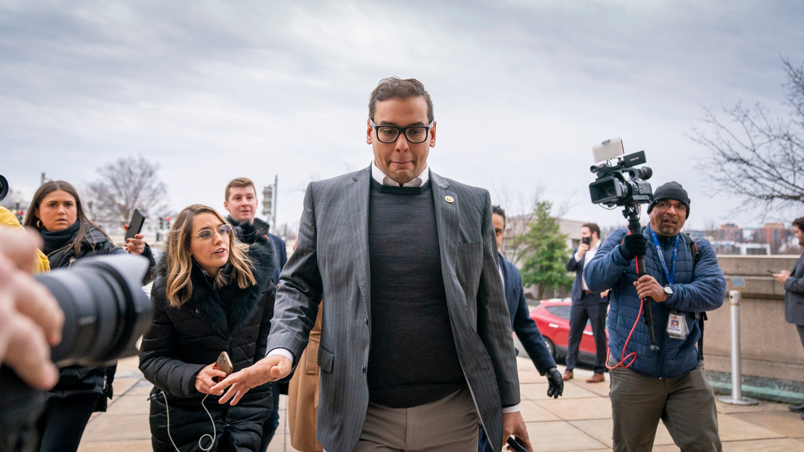 FILE - Rep. George Santos, R-N.Y., leaves a House GOP conference meeting on Capitol Hill in Washington, Jan. 25, 2023. Santos has been arrested on federal criminal charges. The Republican congressman has faced outrage over revelations he fabricated parts of his life story, including lying about being a wealthy Wall Street dealmaker. Santos was arrested Wednesday. (AP Photo/Andrew Harnik, File)