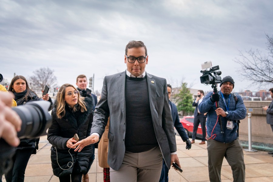 FILE - Rep. George Santos, R-N.Y., leaves a House GOP conference meeting on Capitol Hill in Washington, Jan. 25, 2023. Santos has been arrested on federal criminal charges. The Republican congressman has faced outrage over revelations he fabricated parts of his life story, including lying about being a wealthy Wall Street dealmaker. Santos was arrested Wednesday. (AP Photo/Andrew Harnik, File)