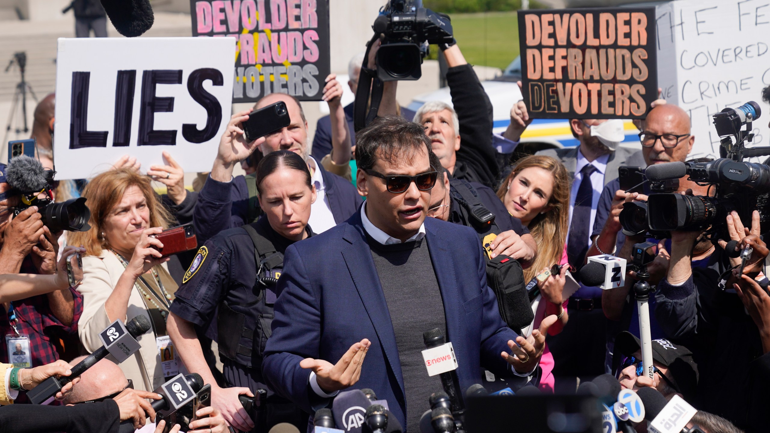 U.S. Rep. George Santos leaves the federal courthouse in Central Islip, N.Y., Wednesday, May 10, 2023. Santos pleaded not guilty to charges alleging a financial fraud at the heart of a political campaign built on dubious boasts about his personal wealth and business success. (AP Photo/Seth Wenig)