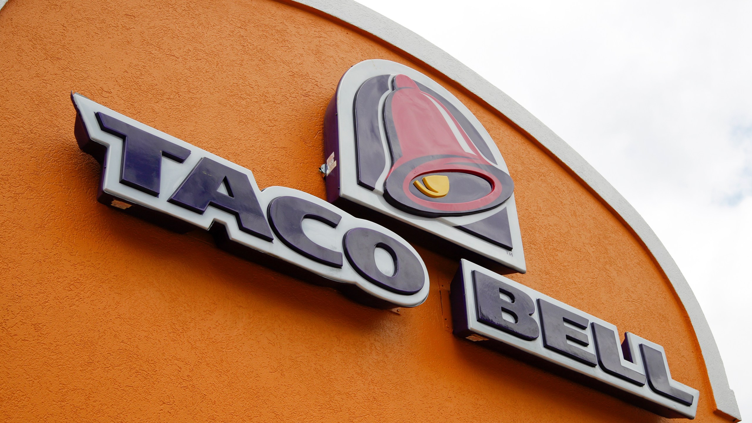 FILE - A sign hangs at a Taco Bell on May 23, 2014, in Mount Lebanon, Pa. Declaring a mission to liberate "Taco Tuesday" for all, Taco Bell asked U.S. regulators Tuesday, May 16, 2023, to force Wyoming-based Taco John's to abandon its longstanding claim to the trademark. (AP Photo/Gene J. Puskar, File)