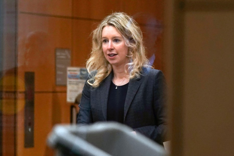 FILE - Former Theranos CEO Elizabeth Holmes arrives at federal court in San Jose, Calif., Oct. 17, 2022. Holmes has once again lost her bid to stay out of prison while she appeals her fraud conviction tied to a blood-testing hoax that bilked investors. In a one-page ruling, the U.S. Court of Appeals for the Ninth Circuit ruled Tuesday, May 16, 2023, that Holmes' appeal did not show that she would have received a shorter sentence or have her conviction reversed due to errors made during her trial. (AP Photo/Jeff Chiu, File)