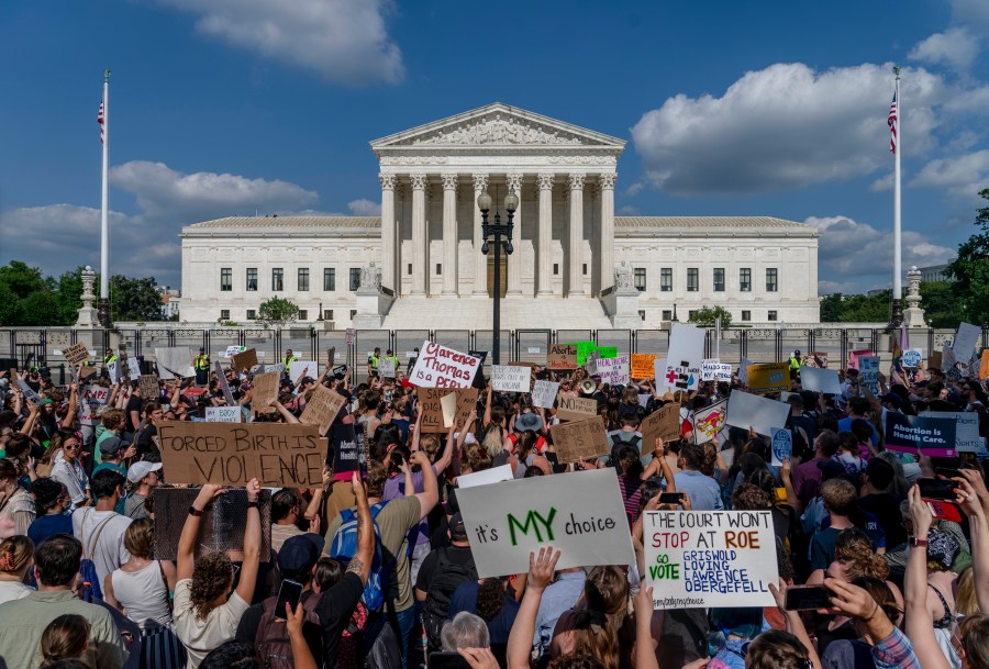 FILE - Abortion-rights and anti-abortion demonstrators gather outside of the Supreme Court in Washington, Friday, June 24, 2022. Confidence in the Supreme Court sank to its lowest point in at least 50 years in 2022, in the wake of the Dobbs decision that led to state bans and other restrictions on abortion. That's according to the General Social Survey, a long-running and widely respected survey conducted by NORC at the University of Chicago that has been measuring confidence in the court since 1973, the same year that Roe v. Wade legalized abortion nationwide.(AP Photo/Gemunu Amarasinghe, File)