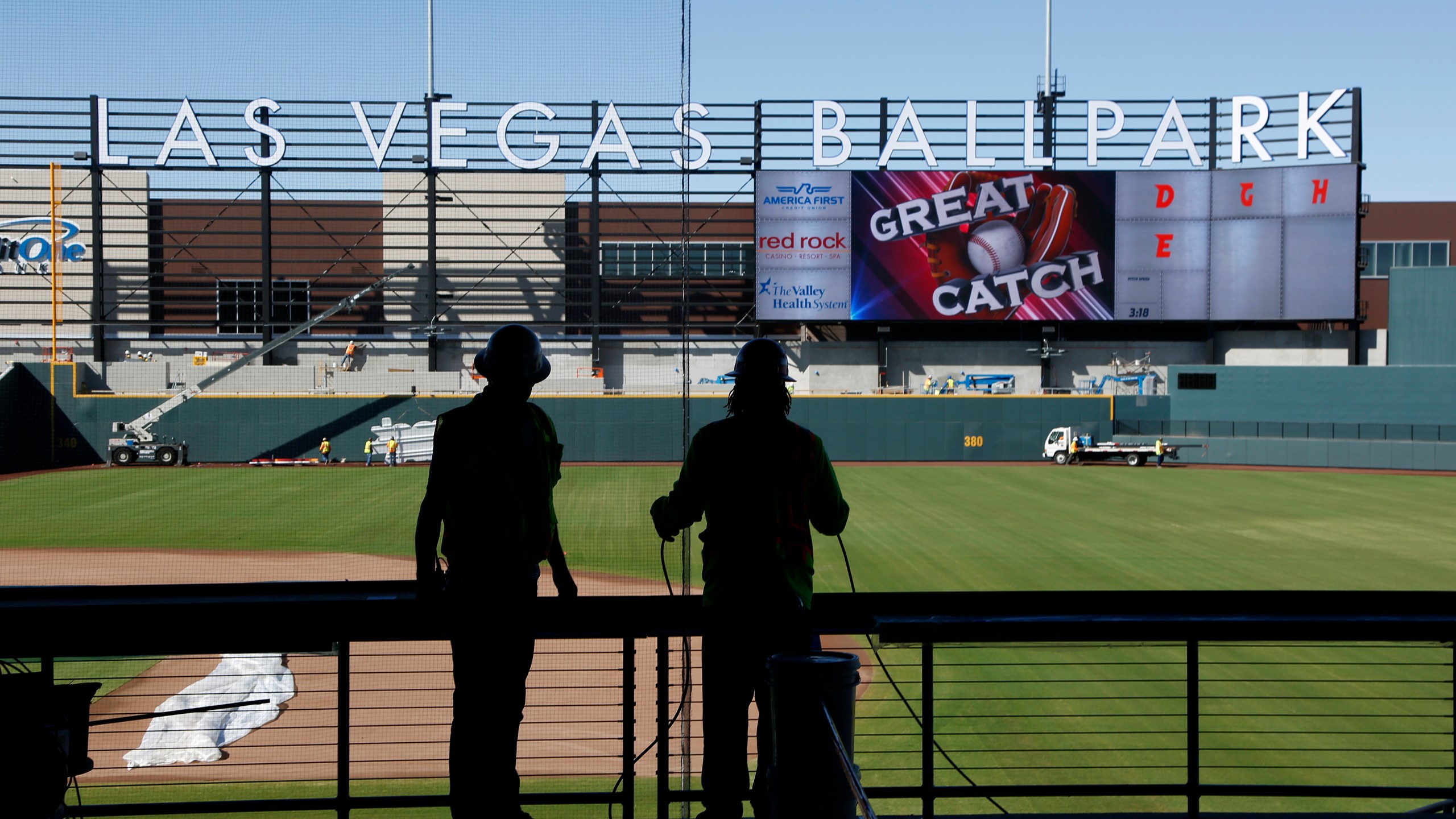 FILE - Workers continue construction on a new baseball park in Las Vegas on March 28, 2019. The Oakland Athletics's lease at Oakland Coliseum runs through 2024, and there is a chance the team would play the 2025 and 2026 seasons at Las Vegas Ballpark, home to their Triple-A affiliate, the Aviators. (AP Photo/John Locher, File)