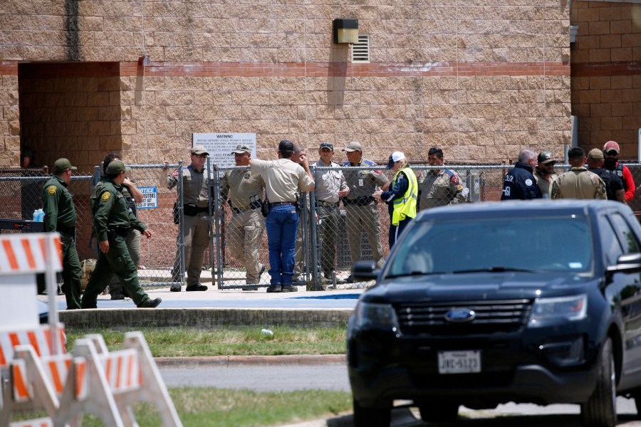 FILE - Law enforcement, and other first responders, gather outside Robb Elementary School following a shooting, May 24, 2022, in Uvalde, Texas. A criminal investigation in Texas over the hesitant police response to the Robb Elementary School shooting remains ongoing a year after a gunman killed 19 children and two teachers in Uvalde. (AP Photo/Dario Lopez-Mills, File)