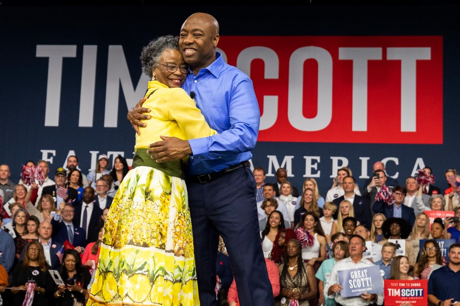 Republican presidential candidate Tim Scott hugs his mother Frances Scott after announcing his candidacy for president of the United States on the campus of Charleston Southern University in North Charleston, S.C., Monday, May 22, 2023. (AP Photo/Mic Smith)