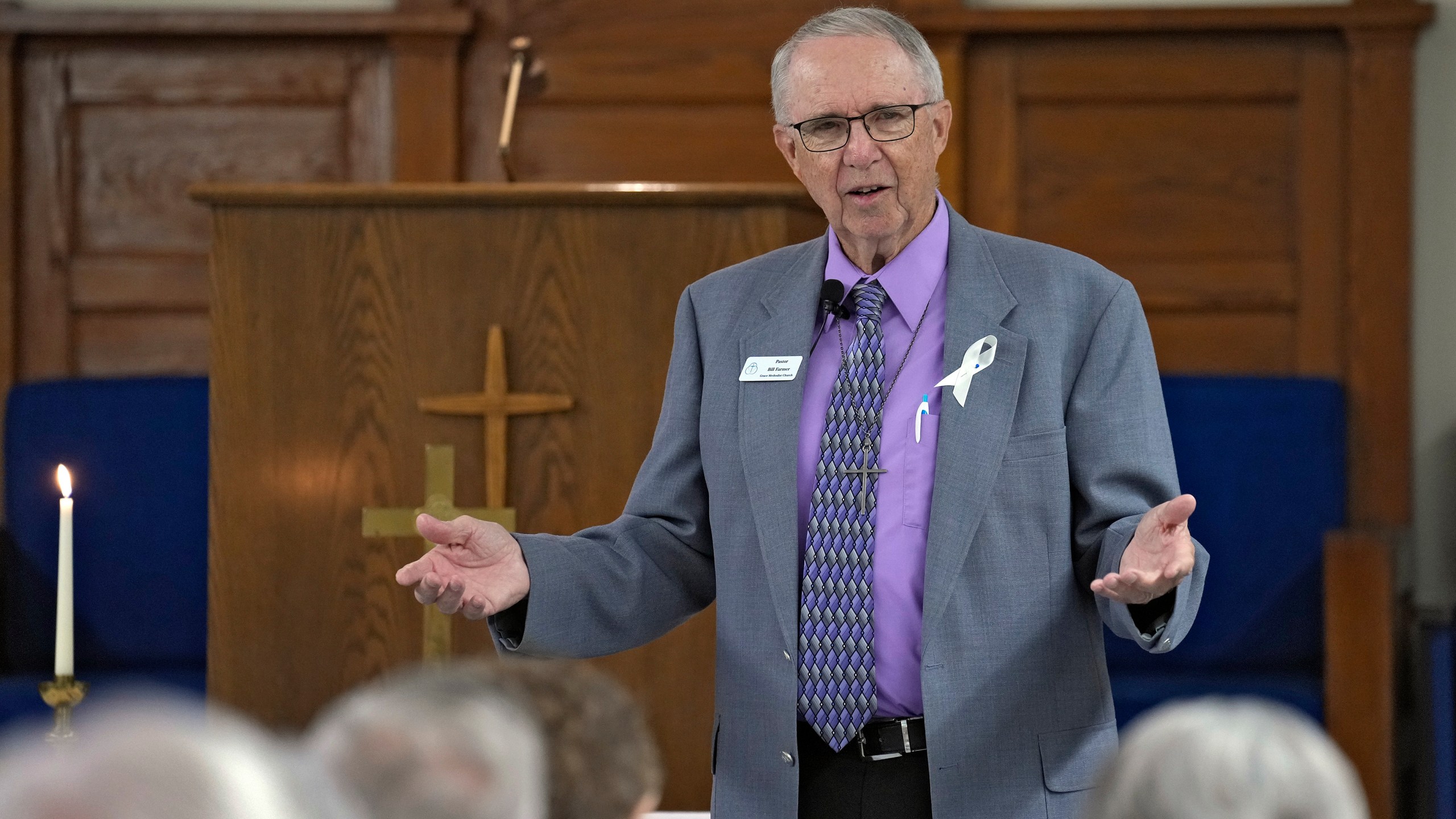 The Rev. Bill Farmer preaches to his congregation at the Grace Methodist Church Sunday, May 14, 2023, in Homosassa Springs, Fla. Farmer came out of retirement to serve as the church's pastor. The group's previous congregation “was a good church,” Farmer said, and he wished it well. But “my struggle was with the United Methodist structure, what’s going on with the United States, particularly." (AP Photo/Chris O'Meara)