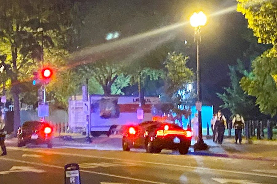 A box truck is seen crashed into a security barrier at a park across from the White House, Monday night, May 22, 2023 in Washington. Police have arrested a man they believe intentionally crashed a U-Haul truck into a security barrier near the north side of Lafayette Square late Monday night. No one was injured. (Benjamin Berger via AP)