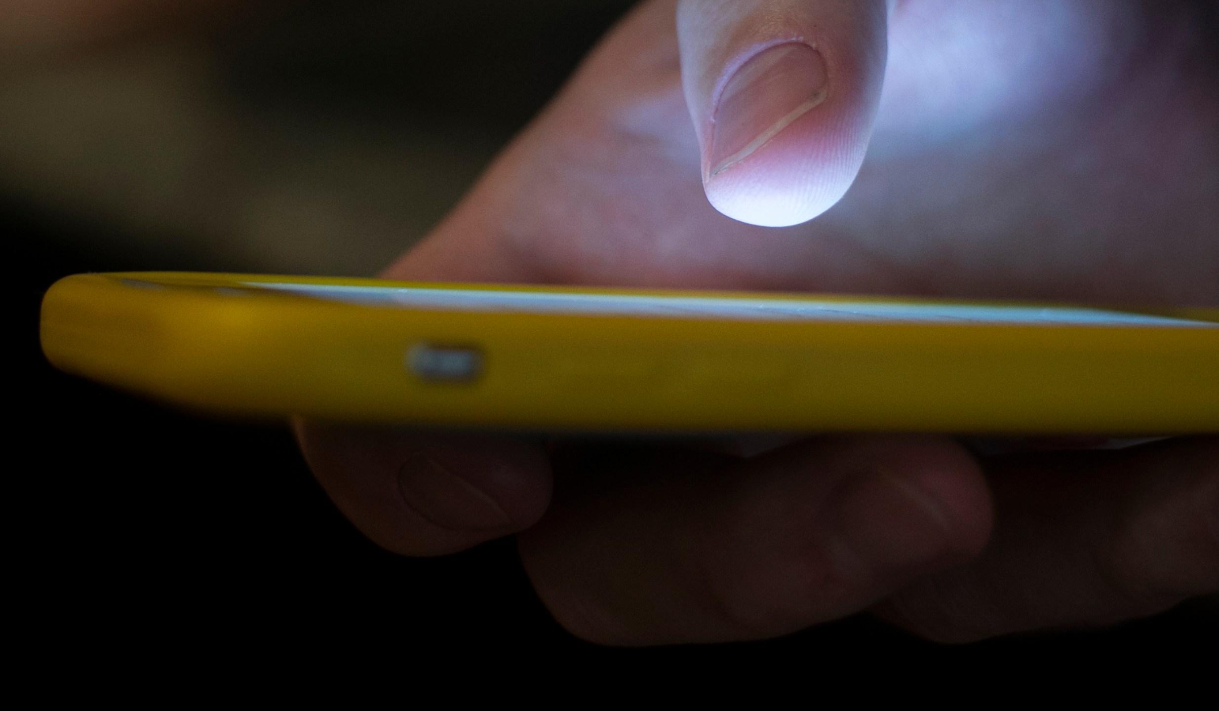 FILE - A man uses a cellphone in New Orleans, Aug. 11, 2019. On Tuesday, May 23, 2023, attorneys general across the U.S. joined in a lawsuit against a telecommunications company accused of making more than 7.5 billion robocalls to people on the national Do Not Call Registry. (AP Photo/Jenny Kane, File)