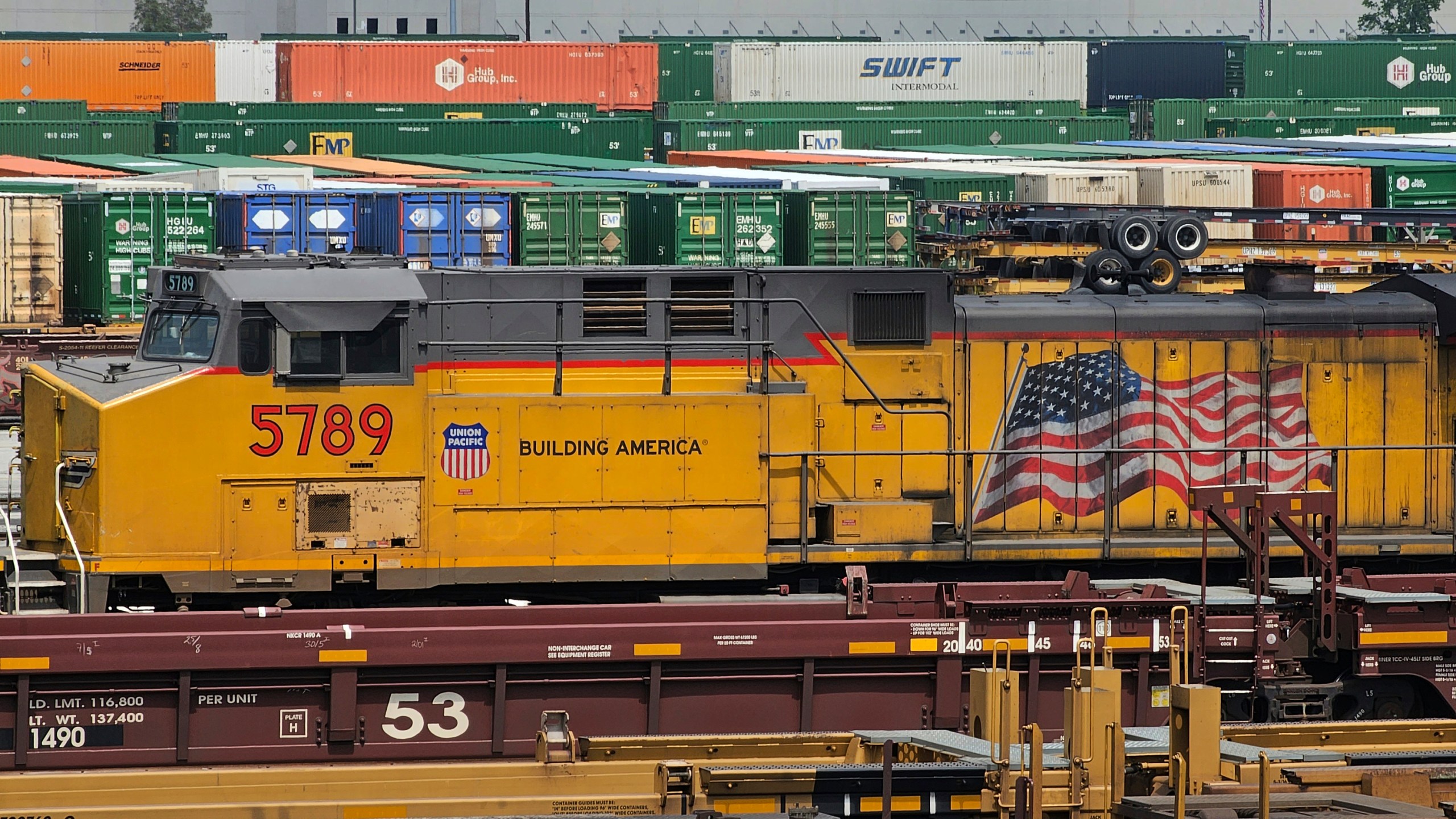 FILE - A train sits at the Union Pacific LATC Intermodal Terminal on April 25, 2023, in Los Angeles. Engineers who operate trains for Union Pacific will soon have much more predictable schedules allowing them to plan when they are going to be off, a change announced Wednesday, May 24, that addresses one of the key quality-of-life concerns that pushed the rail industry to the brink of a strike last fall. (AP Photo/Damian Dovarganes, File)