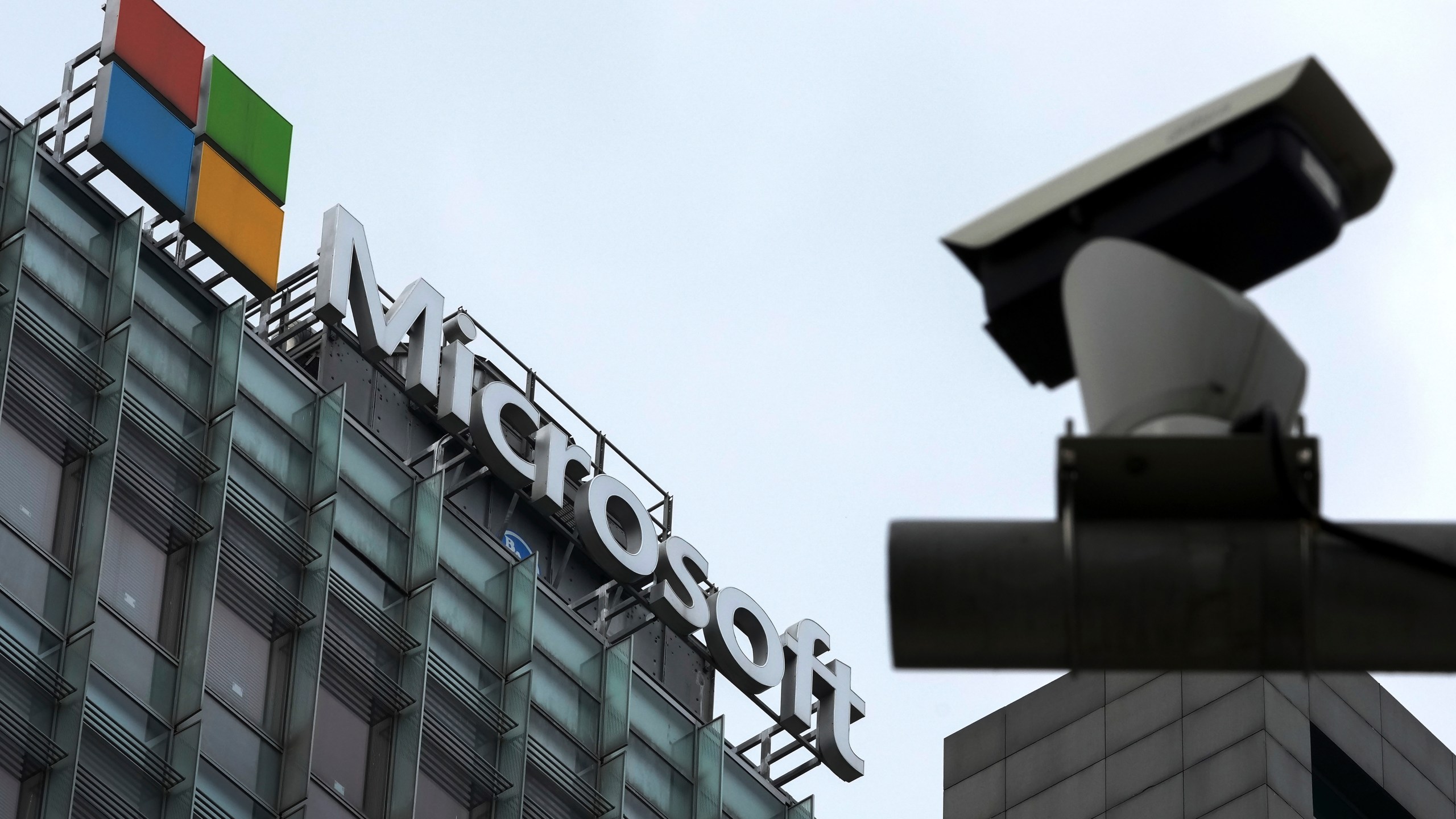 FILE - A security surveillance camera is seen near the Microsoft office building in Beijing, July 20, 2021. State-backed Chinese hackers have been targeting U.S. critical infrastructure and could be laying the technical groundwork for the potential disruption of critical communications between the U.S. and Asia during future crises, Microsoft said Wednesday, May 24, 2023. (AP Photo/Andy Wong, File)