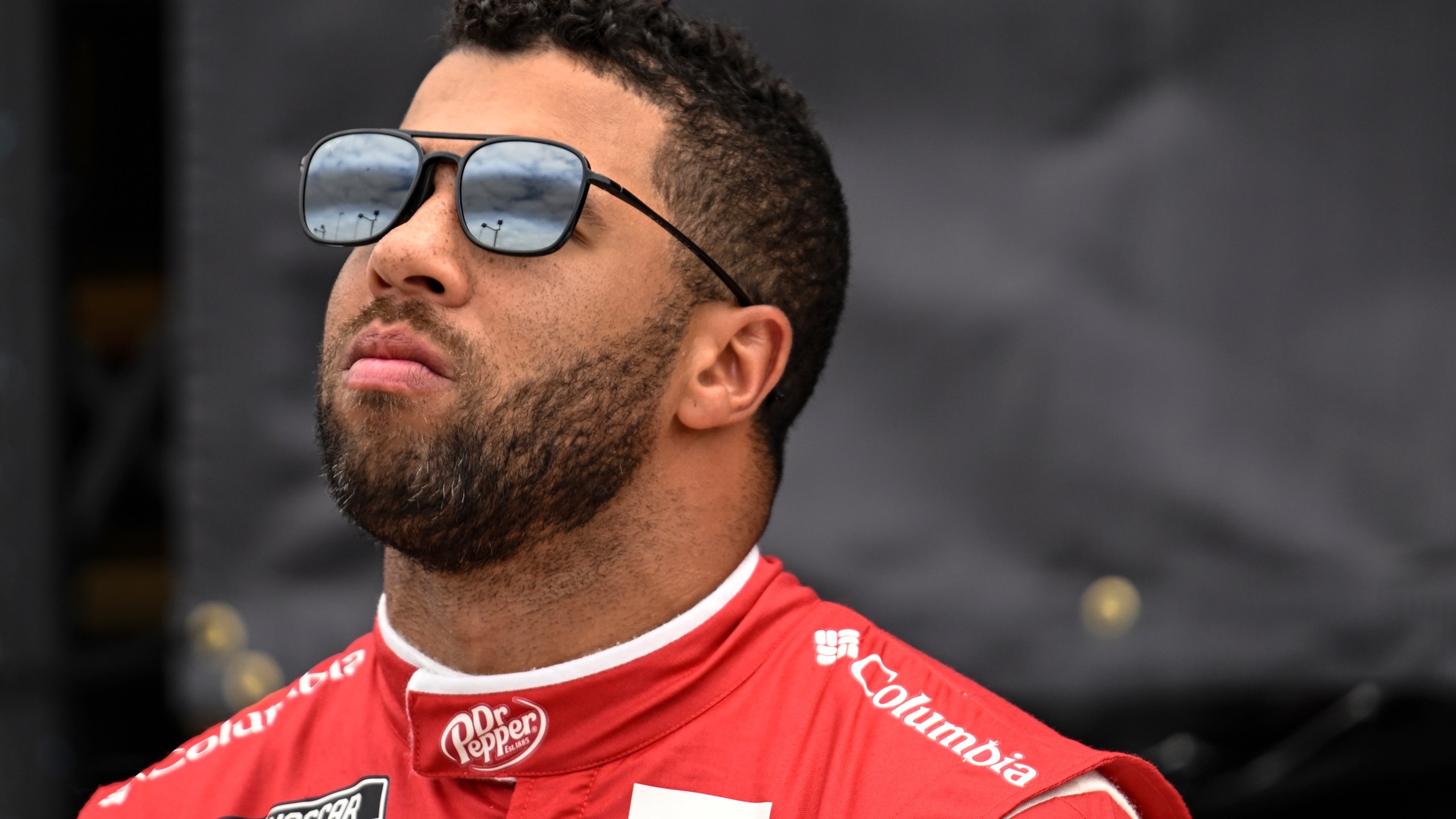 Bubba Wallace looks on prior to a NASCAR Cup Series auto race at Darlington Raceway, Sunday, May 14, 2023, in Darlington, S.C. (AP Photo/Matt Kelley)