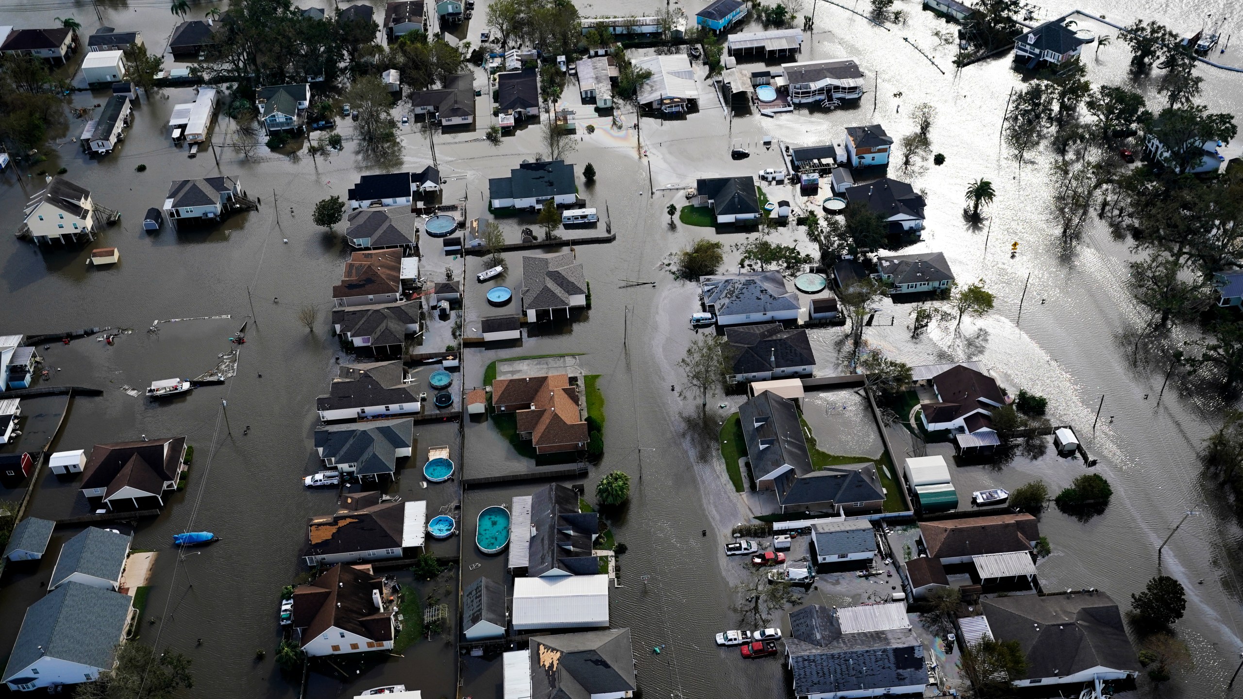 FILE - Homes are flooded in the aftermath of Hurricane Ida, Aug. 30, 2021, in Jean Lafitte, La. National Oceanic and Atmospheric Administration on Thursday, May 25, 2023, announced its forecast for the 2023 hurricane season. (AP Photo/David J. Phillip, File)