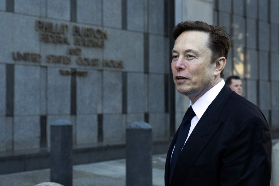 FILE - Elon Musk departs the Phillip Burton Federal Building and United States Court House in San Francisco, on Tuesday, Jan. 24, 2023. Musk’s brain implant company Neuralink says it’s gotten permission to begin testing its device in people. The company made the announcement on Twitter Thursday, May 25, but has provided no details about a potential trial, which was not listed on the U.S. government database of trials. (AP Photo/ Benjamin Fanjoy, File)