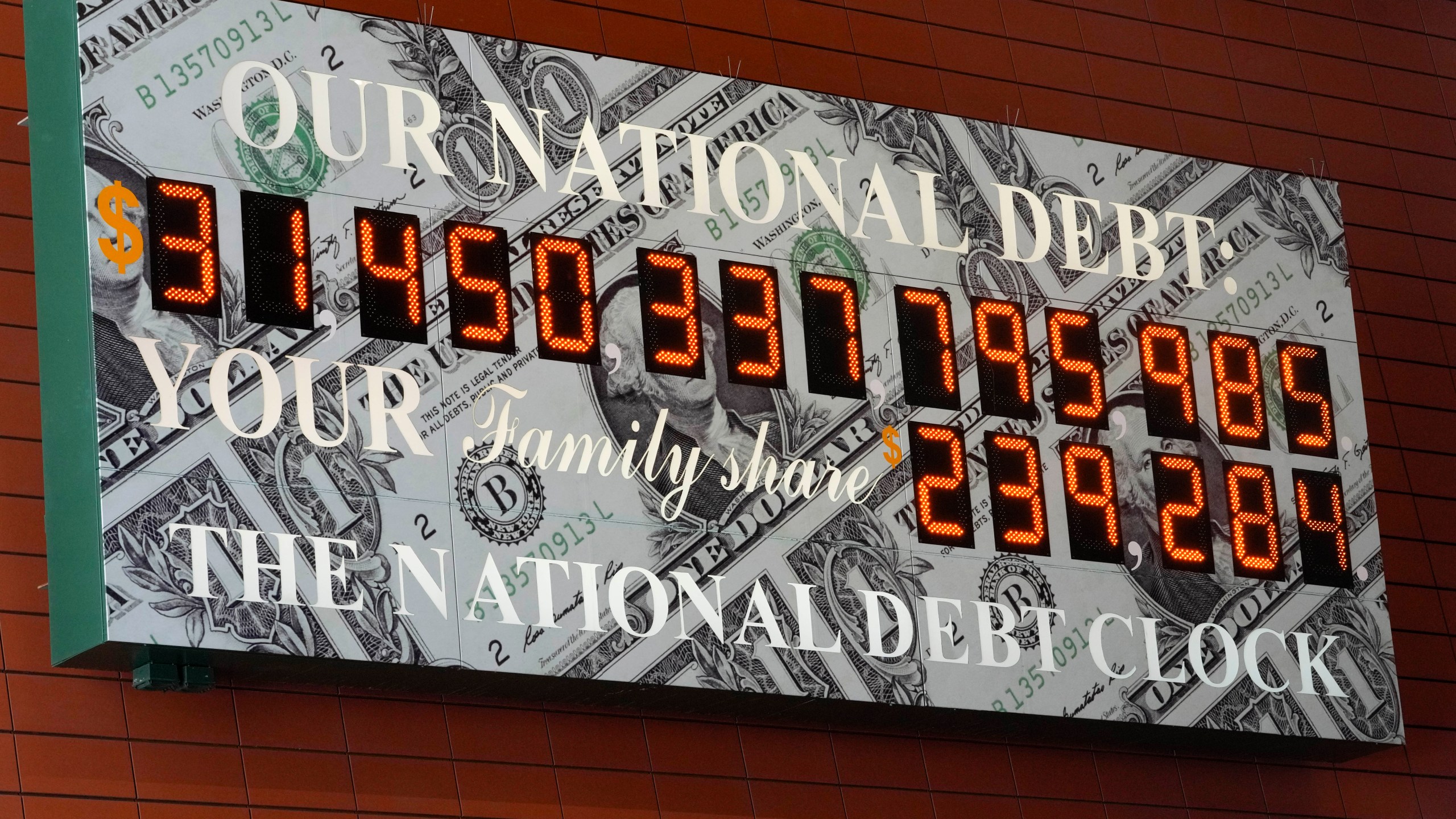 The national debt clock is seen in midtown Manhattan, Thursday, May 25, 2023. Both President Joe Biden and House Speaker Kevin McCarthy are speaking hopefully of the likelihood of an agreement to raise the government's debt limit and avert an economically chaotic federal default. (AP Photo/Mary Altaffer)