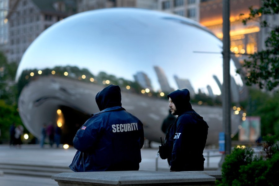 *Private security personnel patrol the area around Anish Kapoor's stainless steel sculpture Cloud Gate, also known as "The Bean," in Chicago's Millennium Park Thursday, May 25, 2023. Chicago is heading into the Memorial Day weekend hoping to head off violence that tends to surge with rising temperatures of summer. Even the state of Illinois is assisting by sending in what it's called "peacekeepers" in an attempt to deescalate violent situations. (AP Photo/Charles Rex Arbogast)