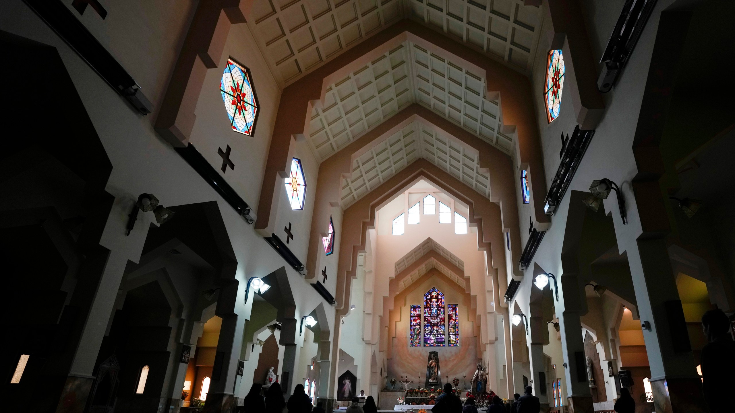 Catholics attend Mass at the Maria Auxiliadora Catholic church in La Paz, Bolivia, Friday, May 26, 2023. Leaders of the Roman Catholic Church in Bolivia are acknowledging that the institution has been deaf to the suffering of victims of sexual abuse at a time when the country has been rocked by a pedophilia scandal involving priests. (AP Photo/Juan Karita).