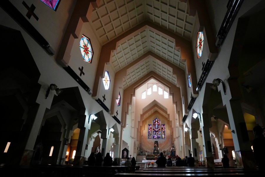 Catholics attend Mass at the Maria Auxiliadora Catholic church in La Paz, Bolivia, Friday, May 26, 2023. Leaders of the Roman Catholic Church in Bolivia are acknowledging that the institution has been deaf to the suffering of victims of sexual abuse at a time when the country has been rocked by a pedophilia scandal involving priests. (AP Photo/Juan Karita).