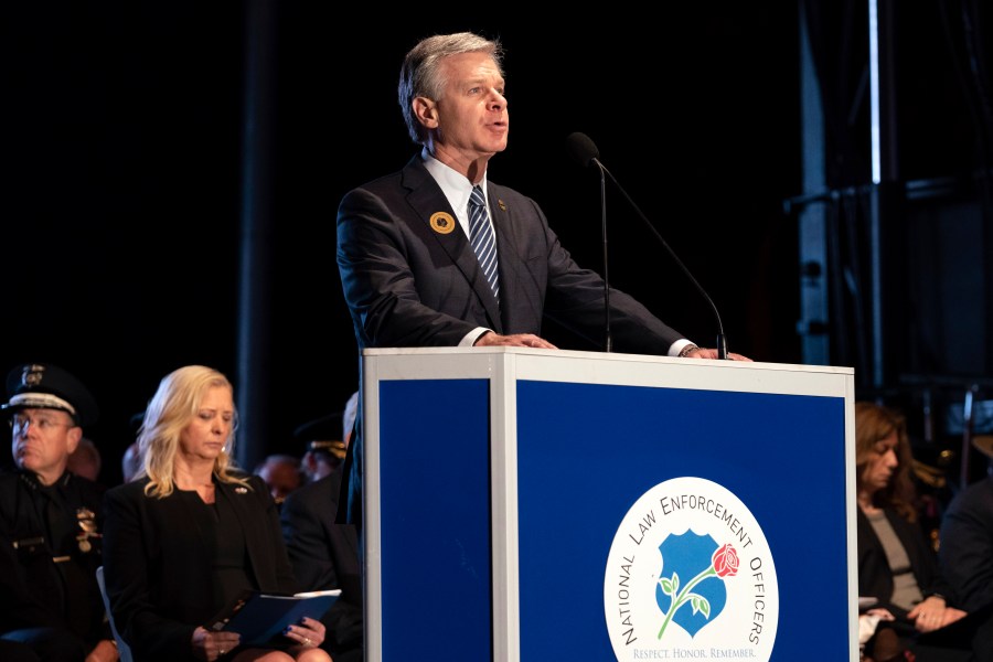 FBI Director Christopher Wray speaks during the 35th Annual Candlelight Vigil to honor the law enforcement officers who lost their lives in 2022, during the National Police Week at the National Mall in Washington, Saturday, May 13, 2023. (AP Photo/Jose Luis Magana)