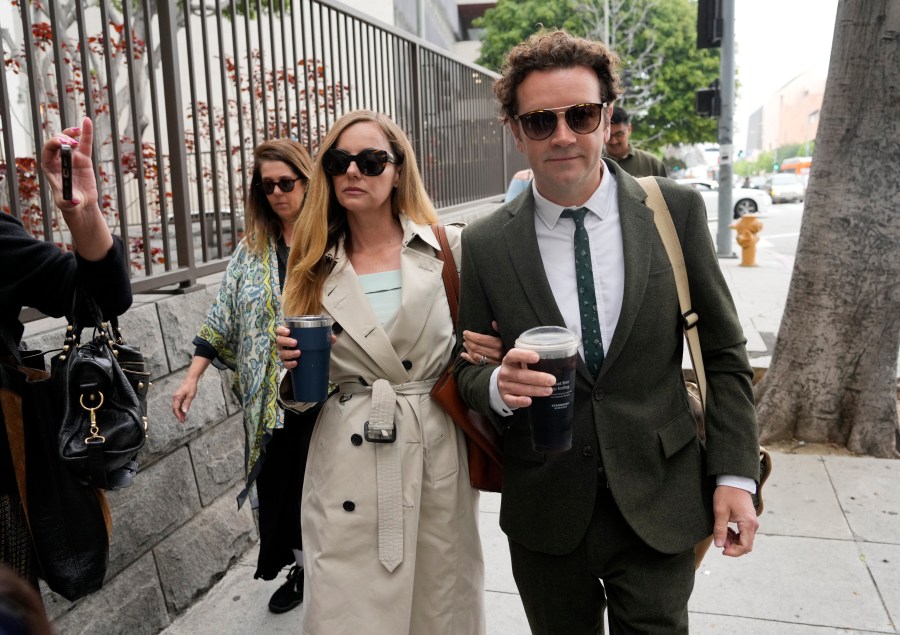 FILE - Danny Masterson, right, and his wife Bijou Phillips arrive for closing arguments in his second trial, May 16, 2023, in Los Angeles. A jury found “That ’70s Show” star Masterson guilty of two counts of rape Wednesday, May 31, in a Los Angeles retrial in which the Church of Scientology played a central role. (AP Photo/Chris Pizzello, File)