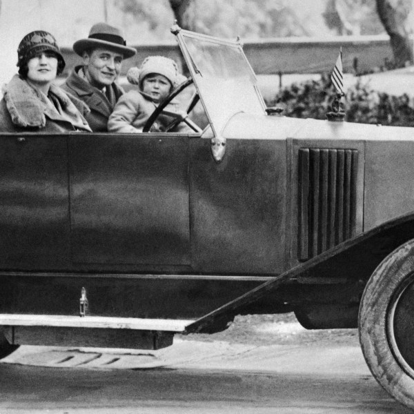 (Original Caption) Celebrated American novelist F. Scott Fitzgerald, his wife Zelda, and daughter, Scottie, go for a motor jaunt somewhere in Italy in this undated photo. Fitzgerald lived in Europe from 1924-1931. he died in 1940.