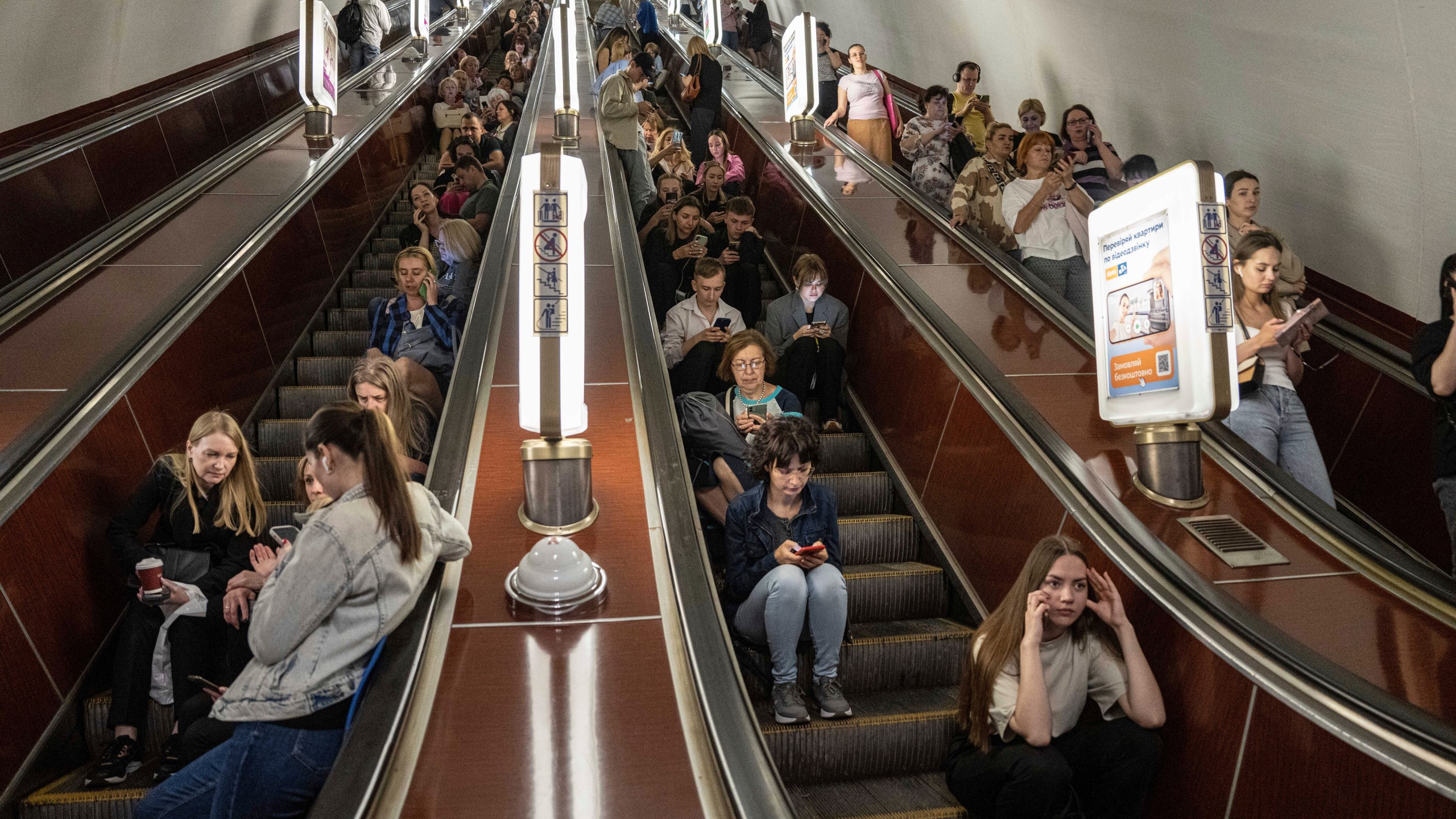 People take cover at a metro station during a Russian rocket attack in Kyiv, Ukraine, Monday, May 29, 2023. (AP Photo/Evgeniy Maloletka)