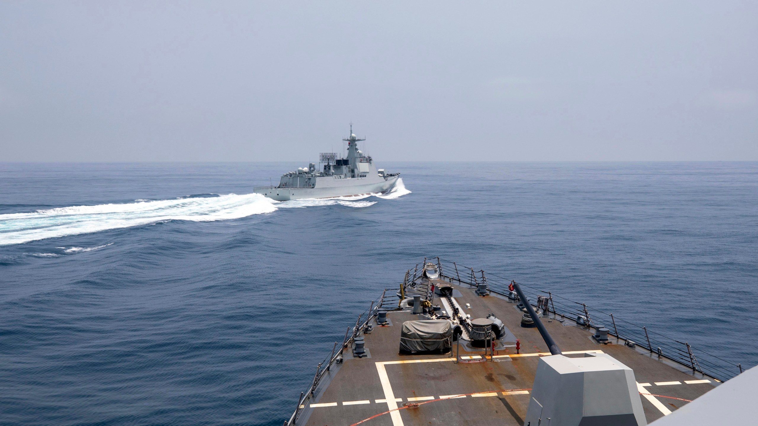 In this photo provided by the U.S. Navy, the USS Chung-Hoon observes a Chinese navy ship conduct what it called an "unsafe” Chinese maneuver in the Taiwan Strait, Saturday, June 3, 2023, in which the Chinese navy ship cut sharply across the path of the American destroyer, forcing the U.S. ship to slow to avoid a collision. The incident occurred as the American destroyer and Canadian frigate HMCS Montreal were conducting a so-called “freedom of navigation” transit of the strait between Taiwan and mainland China. (Mass Communication Specialist 1st Class Andre T. Richard/U.S. Navy via AP)