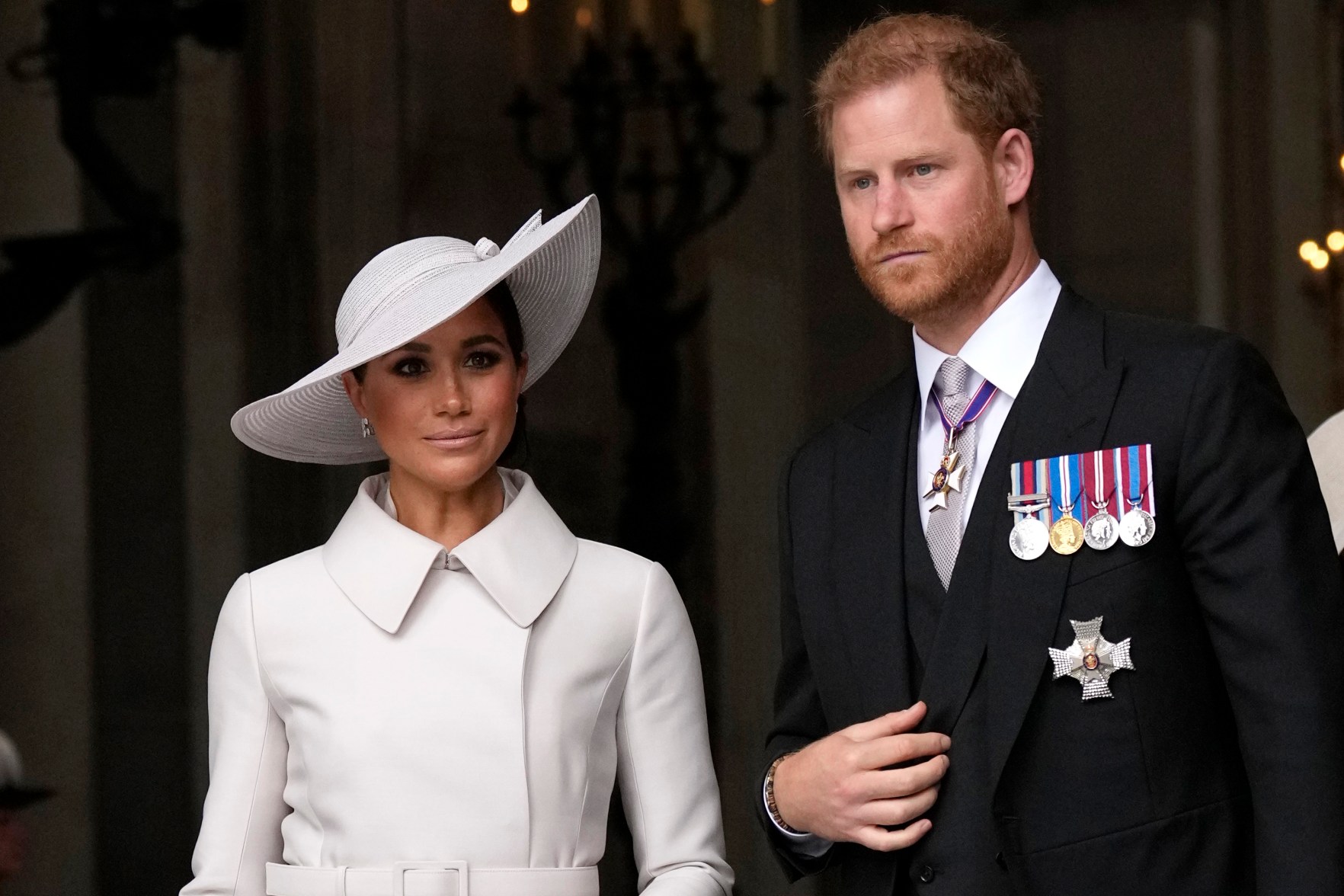 FILE - Prince Harry and Meghan Markle, Duke and Duchess of Sussex leave after a service of thanksgiving for the reign of Queen Elizabeth II at St Paul's Cathedral in London, Friday, June 3, 2022. The Duke of Sussex is scheduled to testify in the High Court after his lawyer presents opening statements Monday, June 5, 2023 in his case alleging phone hacking. It’s the first of Harry’s several legal cases against the media to go to trial and one of three alleging tabloid publishers unlawfully snooped on him. (AP Photo/Matt Dunham, Pool, File)