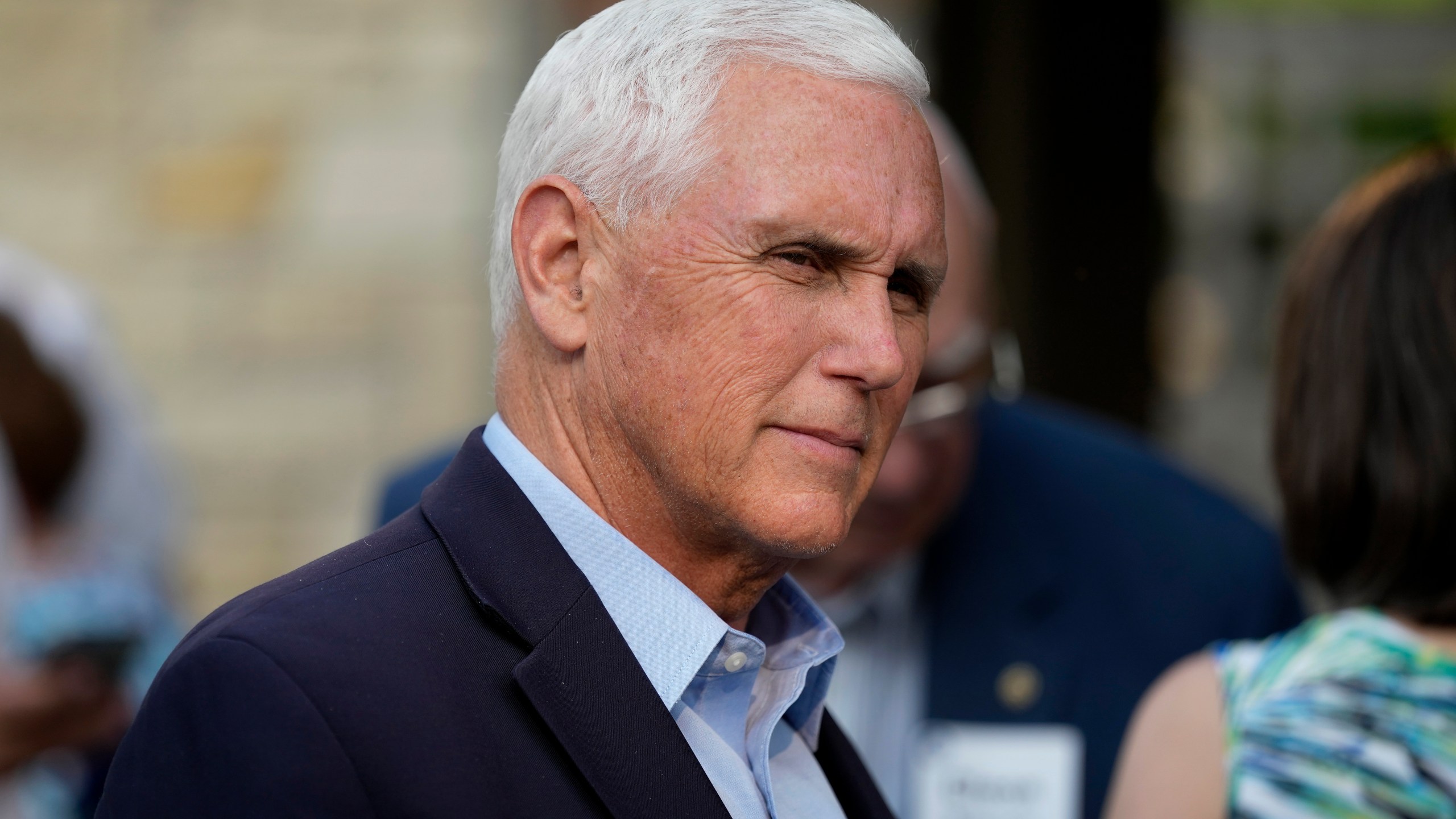 FILE - Former Vice President Mike Pence talks with local residents during a meet and greet on May 23, 2023, in Des Moines, Iowa. Pence will officially launch his widely expected campaign for the Republican nomination for president in Iowa on June 7. (AP Photo/Charlie Neibergall)