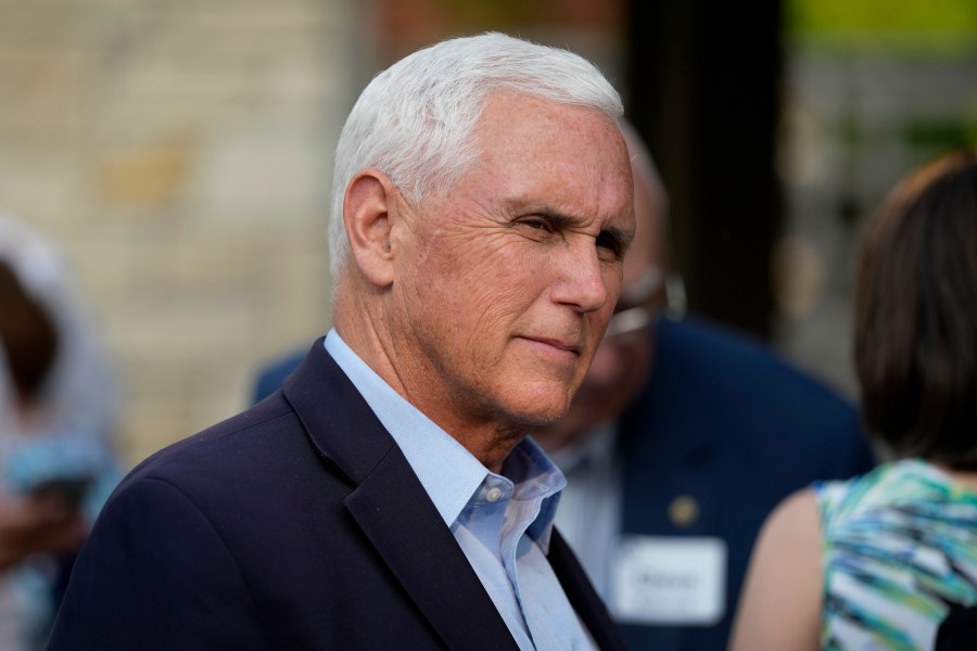 FILE - Former Vice President Mike Pence talks with local residents during a meet and greet on May 23, 2023, in Des Moines, Iowa. Pence will officially launch his widely expected campaign for the Republican nomination for president in Iowa on June 7. (AP Photo/Charlie Neibergall)