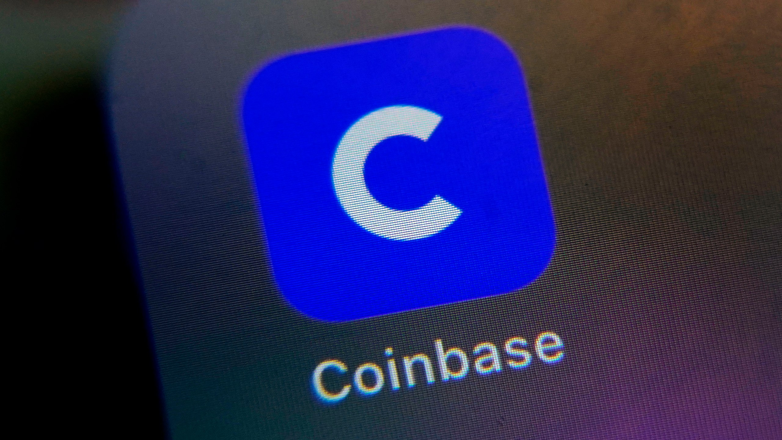 File - The mobile phone icon for the Coinbase app is shown in this photo, in New York, Tuesday, April 13, 2021. The Securities and Exchange Commission is charging Coinbase with operating its crypto asset trading platform as an unregistered national securities exchange, broker, and clearing agency. (AP Photo/Richard Drew, File)