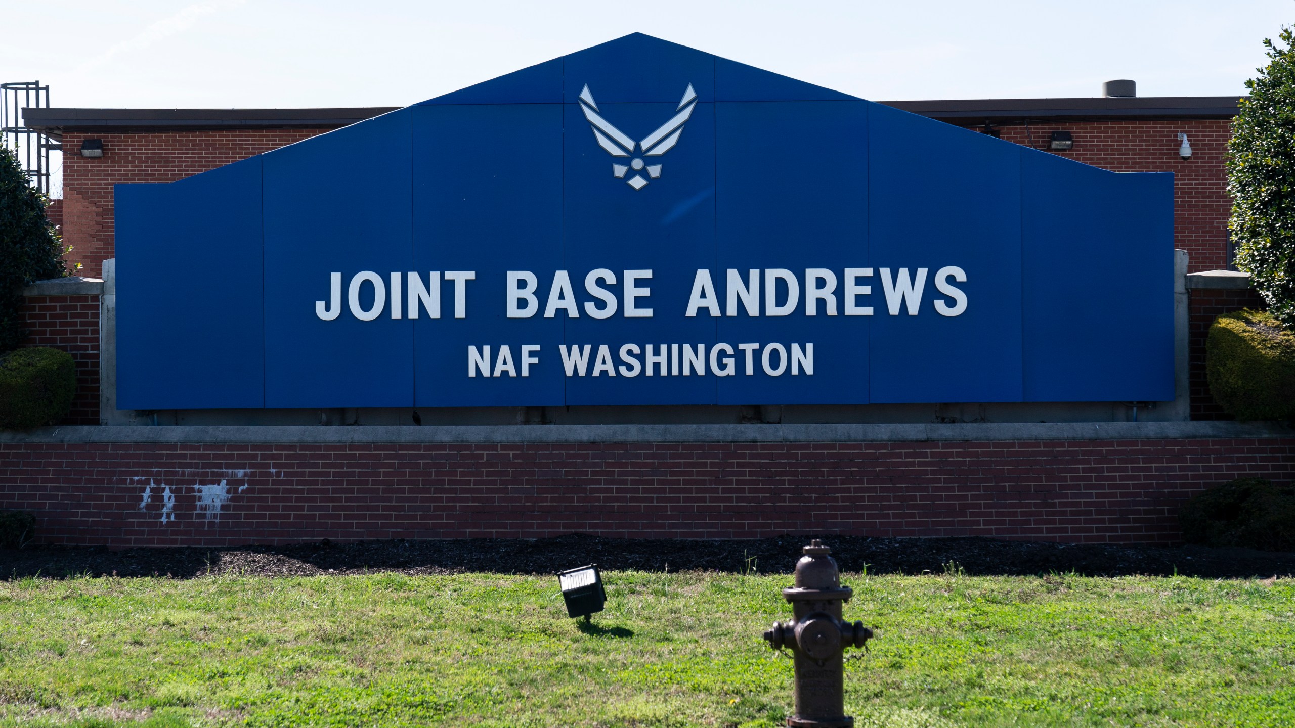 FILE - The sign for Joint Base Andrews is seen on March 26, 2021, at Andrews Air Force Base, Md. A wayward and unresponsive business jet that flew over the nation's capital Sunday afternoon, June 4, 2023, caused the military to scramble a fighter plane from Joint Base Andrews before the jet crashed in Virginia, officials said. The fighter jet caused a loud sonic boom that was heard across the capital region. (AP Photo/Alex Brandon, File)