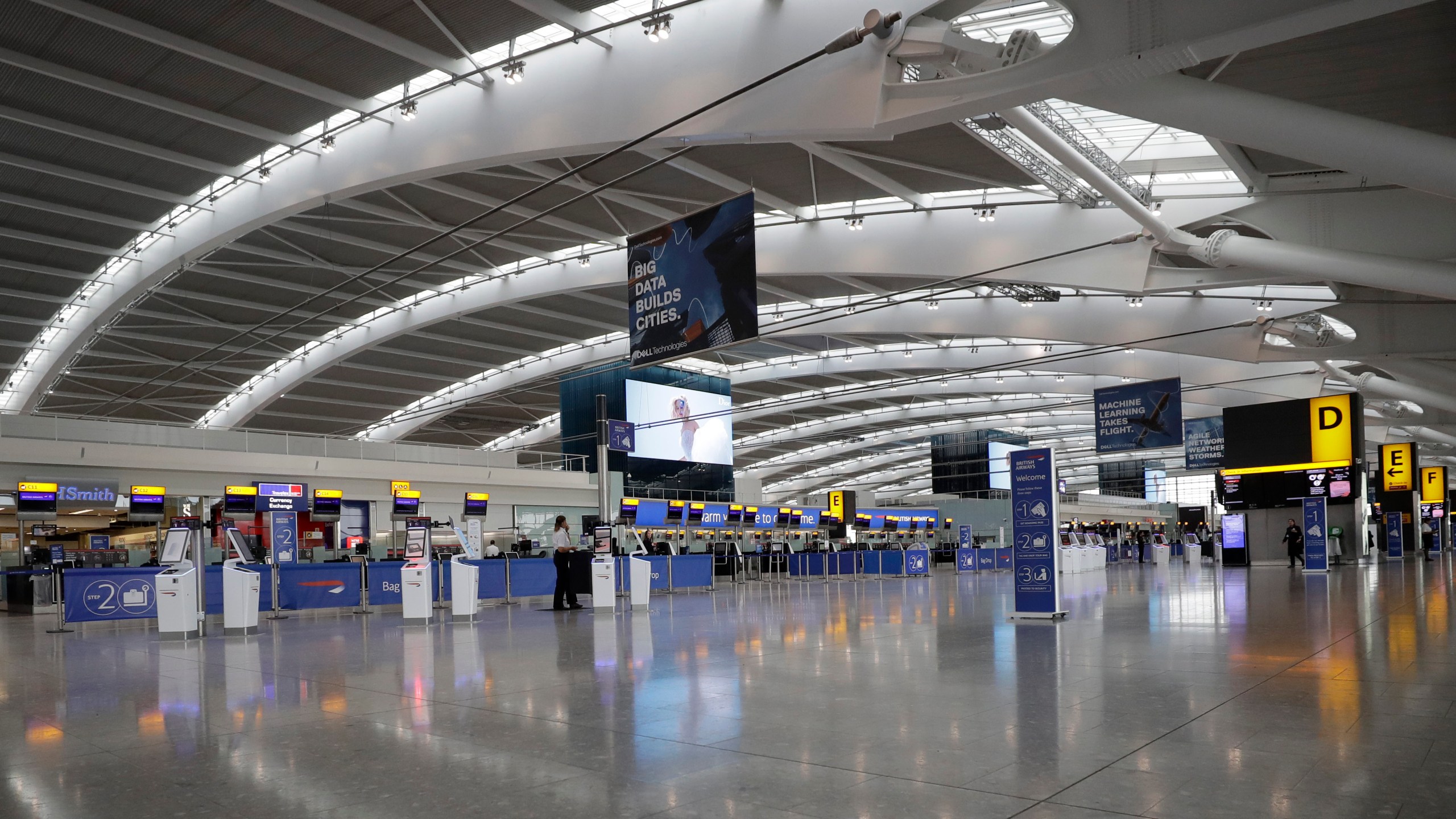 FILE - Terminal 5 at Heathrow Airport in London stands empty of passengers as staff standby to help during a British Airways pilots' strike, Monday, Sept. 9, 2019. Security guards at London’s Heathrow Airport, Europe’s busiest, are to escalate their strike action over pay into the busy summer months. The Unite union said Wednesday that more than 2,000 of its members will walk out for 31 days from June 24 through to Aug. 27, a move that could well wreak havoc for the millions of people going through Heathrow during the great British summer getaway. . (AP Photo/Matt Dunham, File)