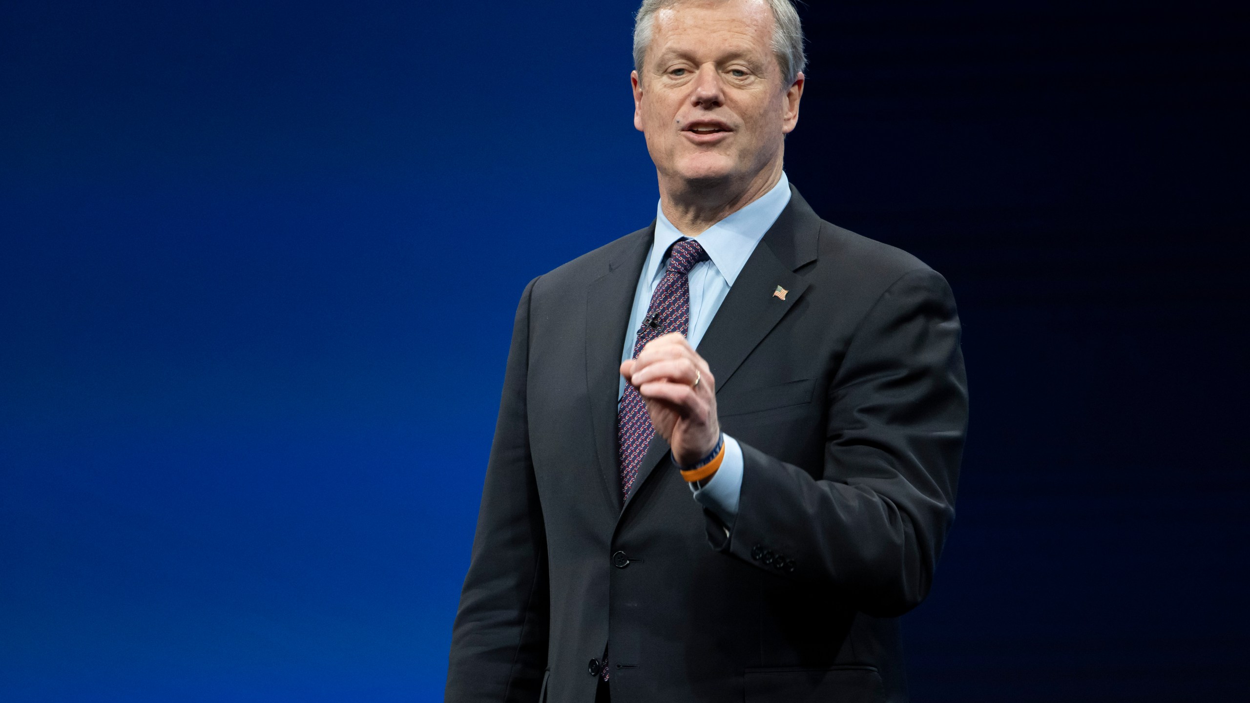 FILE - Incoming NCAA president Charlie Baker speaks during the NCAA Convention, Thursday, Jan. 12, 2023, in San Antonio. NCAA President Charlie Baker wants a federal law to regulate the way college athletes can be compensated for name, image and likeness that creates a registry of deals, agent certification and uniform contract standards. (AP Photo/Darren Abate, File)