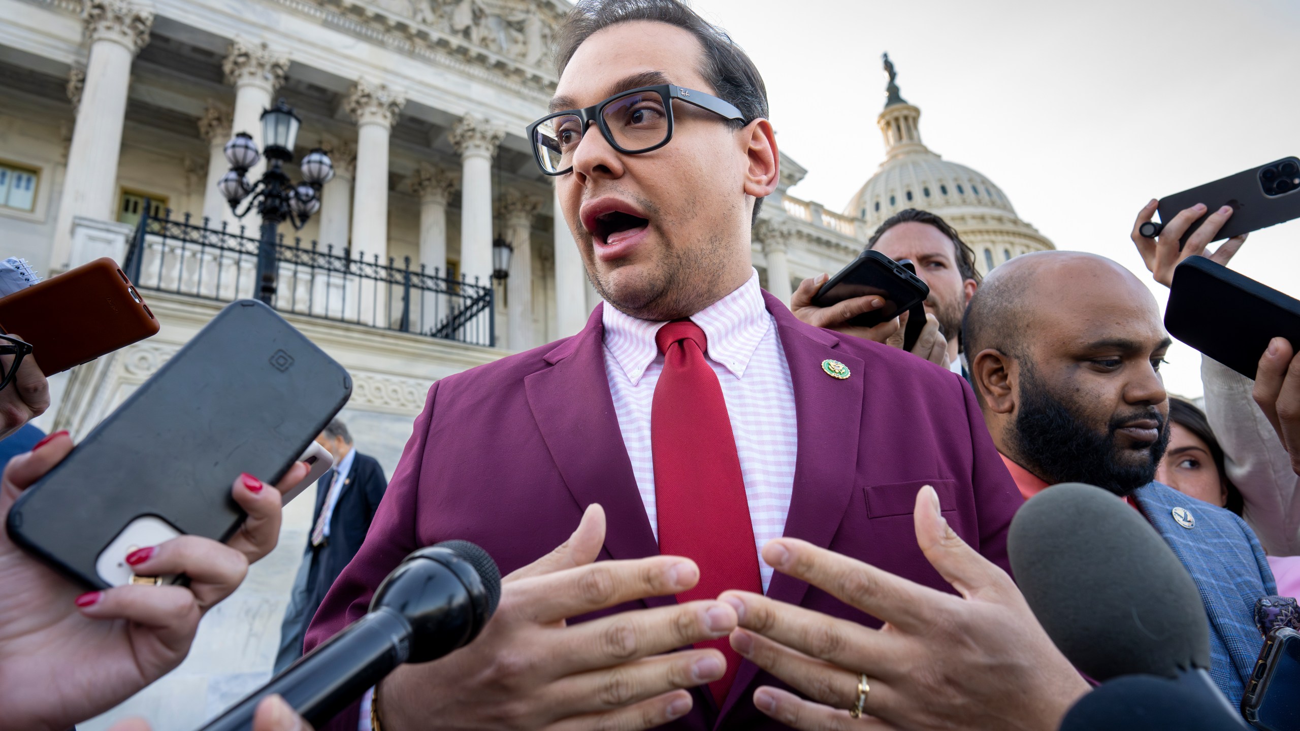 FILE - Rep. George Santos, R-N.Y., speaks to reporters outside after an effort to expel him from the House, at the Capitol in Washington, Wednesday, May 17, 2023. Santos wants to protect family members by asking that the courts keep his bond cosigners secret as he fights criminal charges, his lawyer told a Long Island federal judge Friday, June 9, as he asked her to reverse a magistrate judge's decision to make the names public. (AP Photo/J. Scott Applewhite, File)