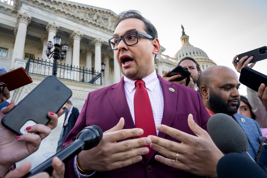 FILE - Rep. George Santos, R-N.Y., speaks to reporters outside after an effort to expel him from the House, at the Capitol in Washington, Wednesday, May 17, 2023. Santos wants to protect family members by asking that the courts keep his bond cosigners secret as he fights criminal charges, his lawyer told a Long Island federal judge Friday, June 9, as he asked her to reverse a magistrate judge's decision to make the names public. (AP Photo/J. Scott Applewhite, File)