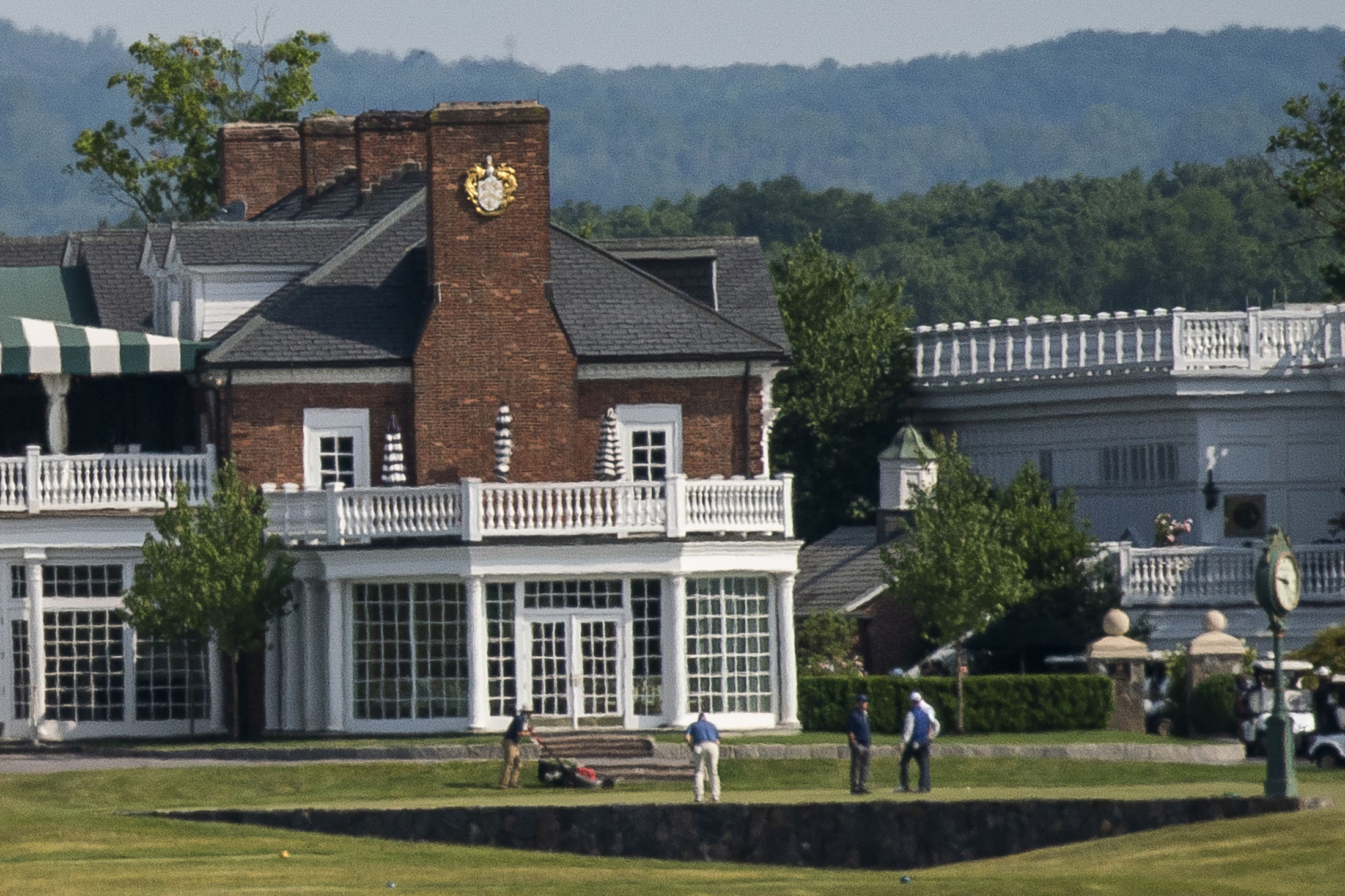 People play golf next to the Trump National Golf Club Bedminster's clubhouse in Bedminister on Friday, June 9 , 2023, in New Jersey. Former President Donald Trump has been indicted on charges of mishandling classified documents at his Florida estate. The remarkable development makes him the first former president in U.S. history to face criminal charges by the federal government that he once oversaw. (AP Photo/Eduardo Munoz Alvarez)