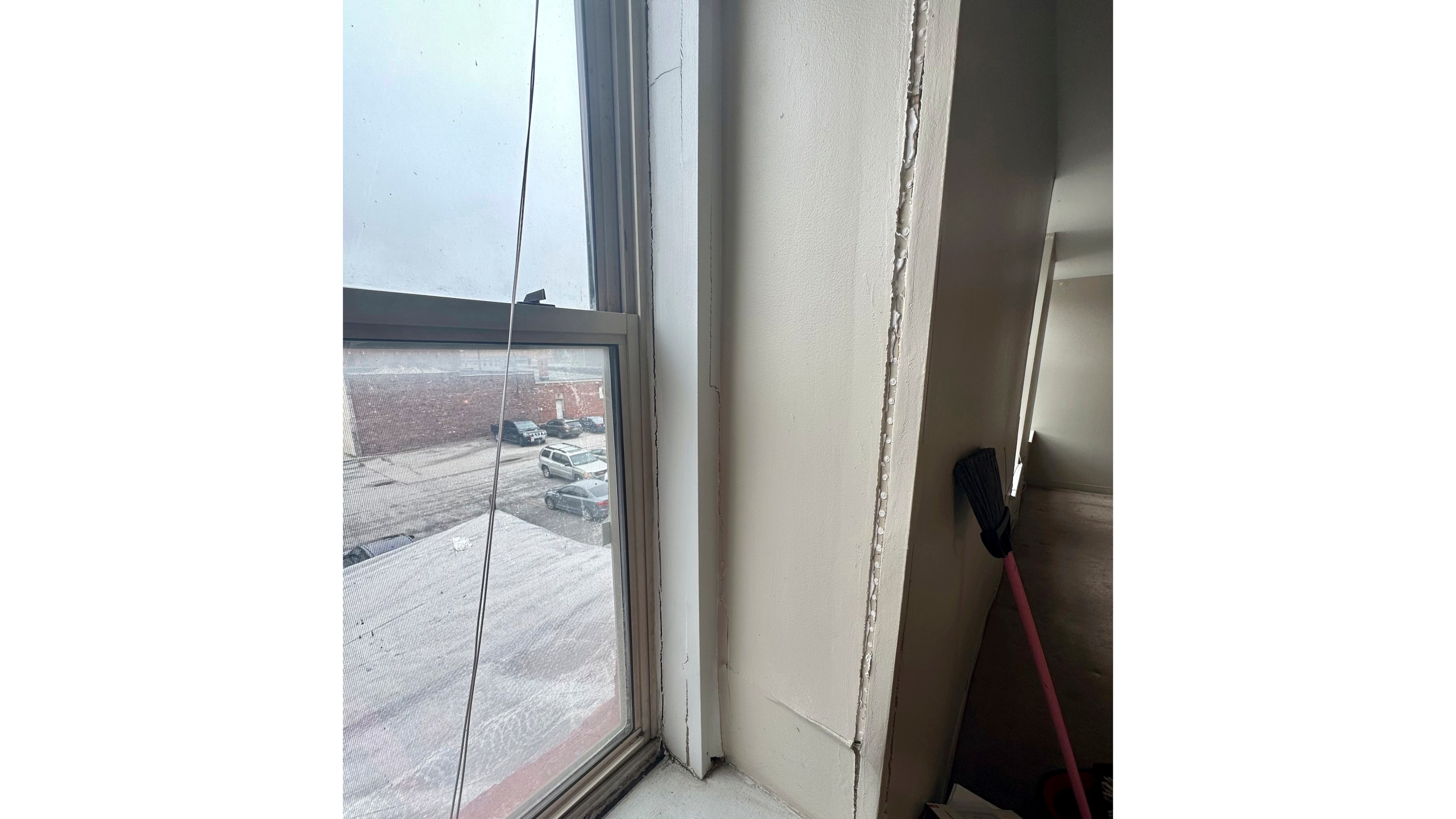 Cracks run along the window sill in an apartment rented by Shauna Dixon before a section of the 116-year-old Davenport apartment building later collapsed in May. The collapse left three dead, and about 50 homeless without their possessions. (Shauna Dixon via AP)